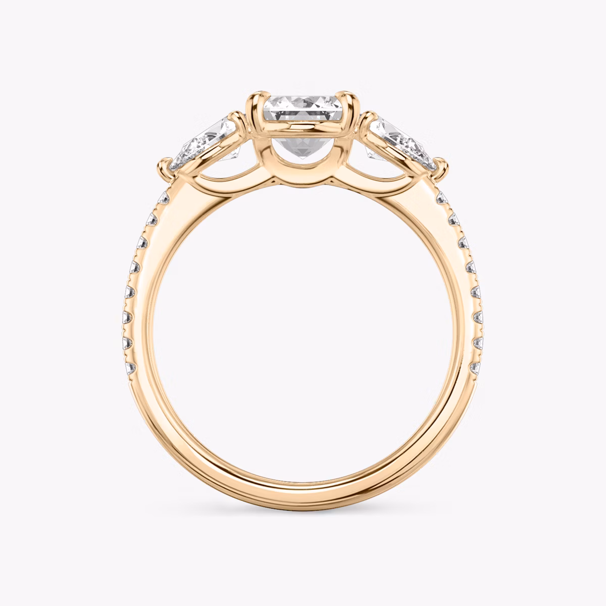The Three Stone | Emerald | 14k | Rose Gold | bandAccent: Pavé | sideStoneCarat: 0.25ct | sideStoneShape: Pear | diamondOrientation: vertical | caratWeight: other