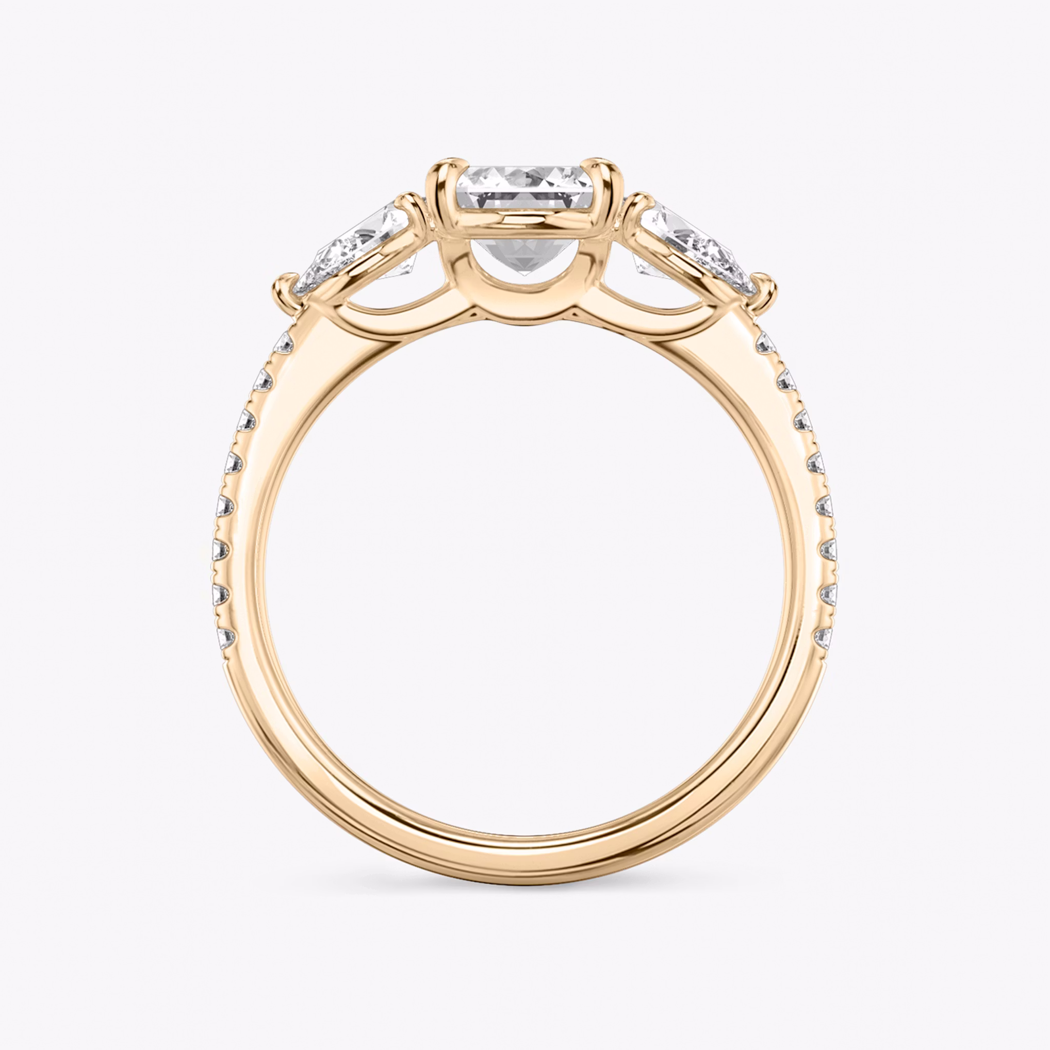 The Three Stone | Emerald | 14k | Rose Gold | bandAccent: Pavé | sideStoneCarat: 0.25ct | sideStoneShape: Pear | diamondOrientation: vertical | caratWeight: other