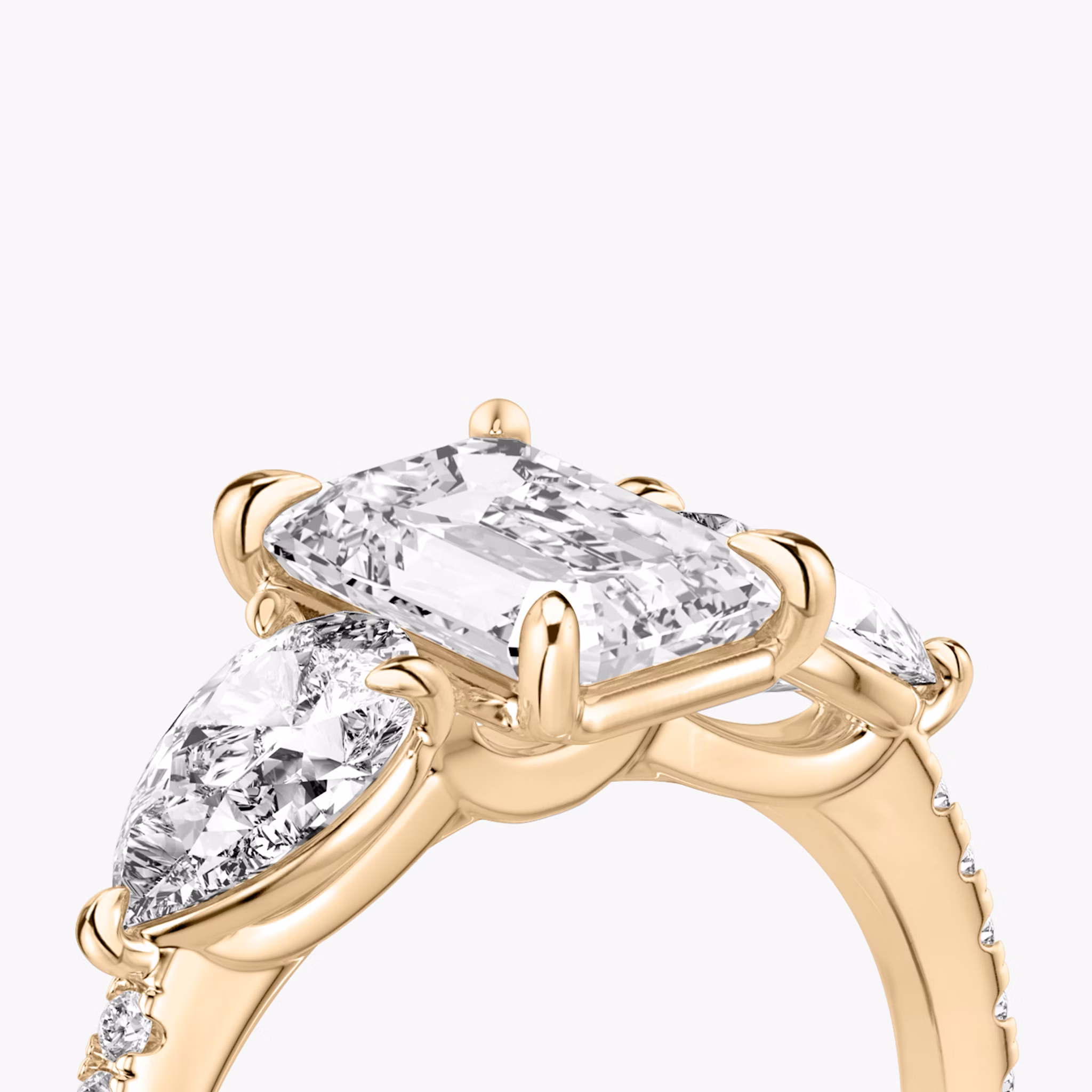 The Three Stone | Emerald | 14k | Rose Gold | bandAccent: Pavé | sideStoneCarat: 0.50ct | sideStoneShape: Pear | diamondOrientation: vertical | caratWeight: other