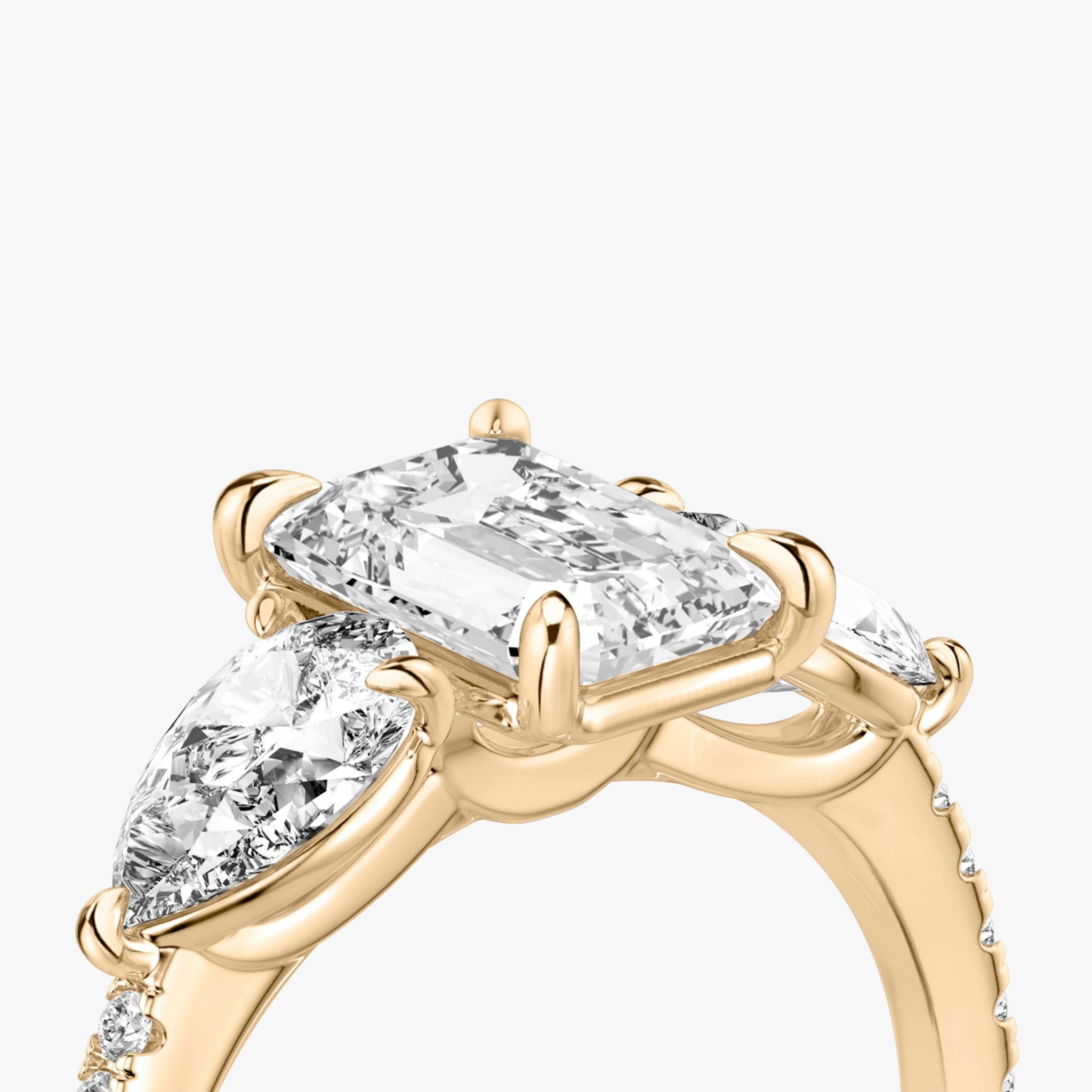The Three Stone | Emerald | 14k | Rose Gold | bandAccent: Pavé | sideStoneCarat: 0.50ct | sideStoneShape: Pear | diamondOrientation: vertical | caratWeight: other