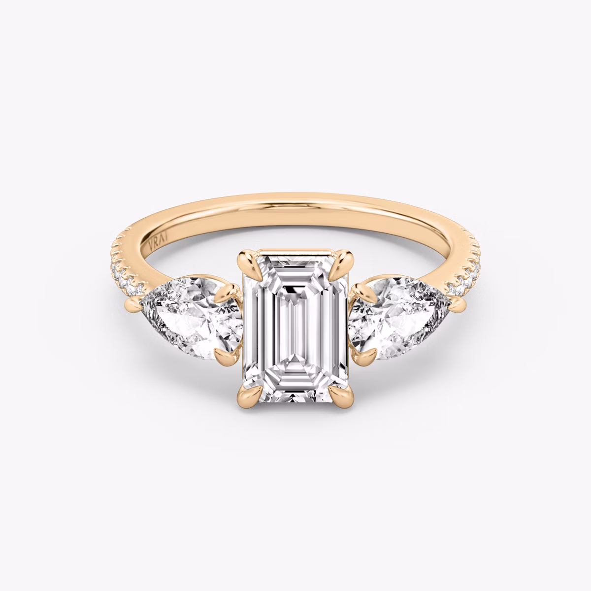 The Three Stone | Emerald | 14k | Rose Gold | bandAccent: Pavé | sideStoneCarat: 0.50ct | sideStoneShape: Pear | diamondOrientation: vertical | caratWeight: other