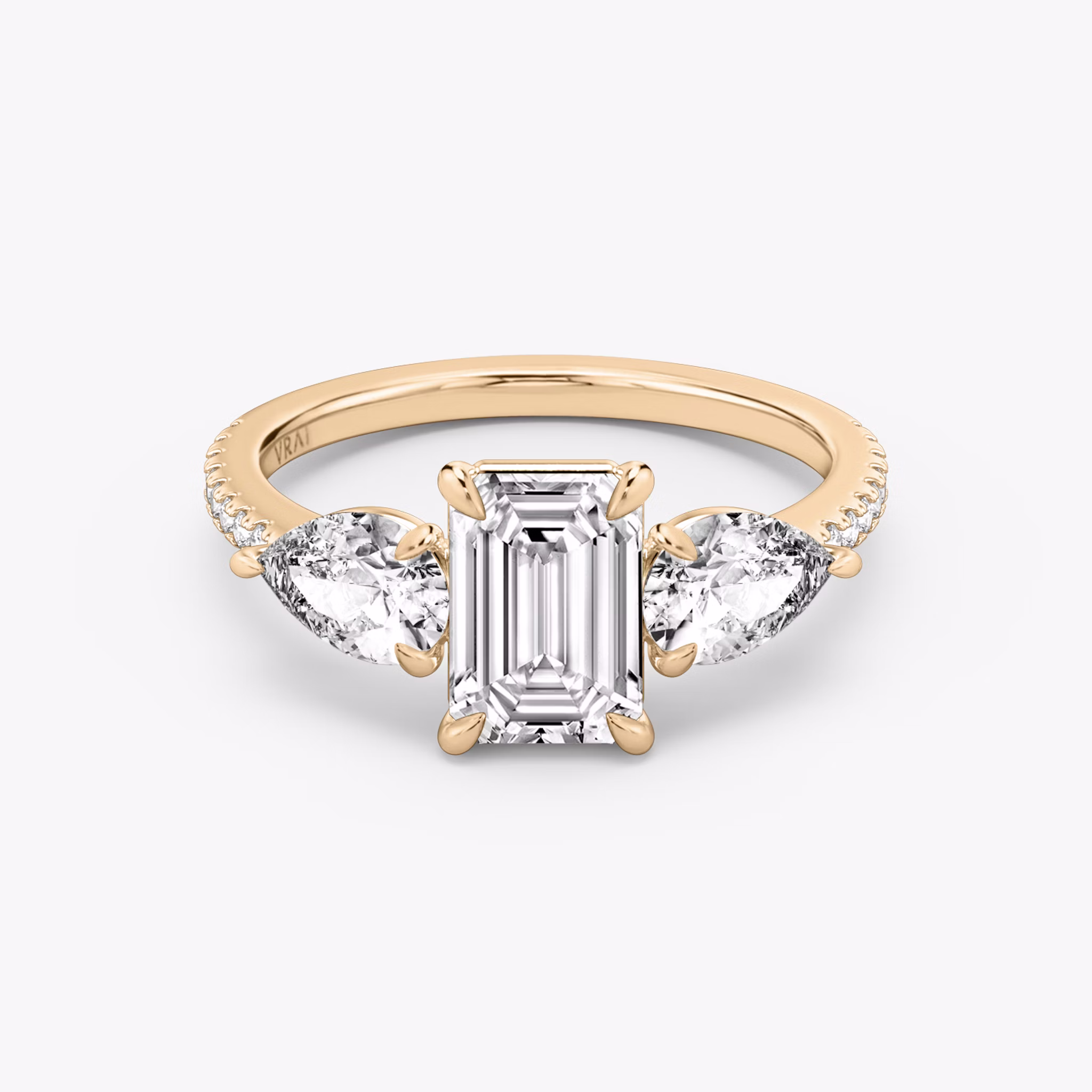 The Three Stone | Emerald | 14k | Rose Gold | bandAccent: Pavé | sideStoneCarat: 0.50ct | sideStoneShape: Pear | diamondOrientation: vertical | caratWeight: other