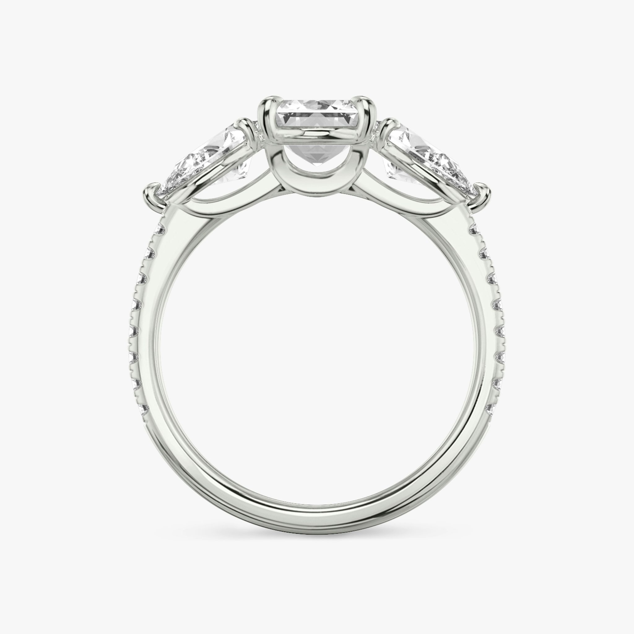 The Three Stone | Emerald | Platinum | bandAccent: Pavé | sideStoneCarat: 0.50ct | sideStoneShape: Pear | diamondOrientation: vertical | caratWeight: other