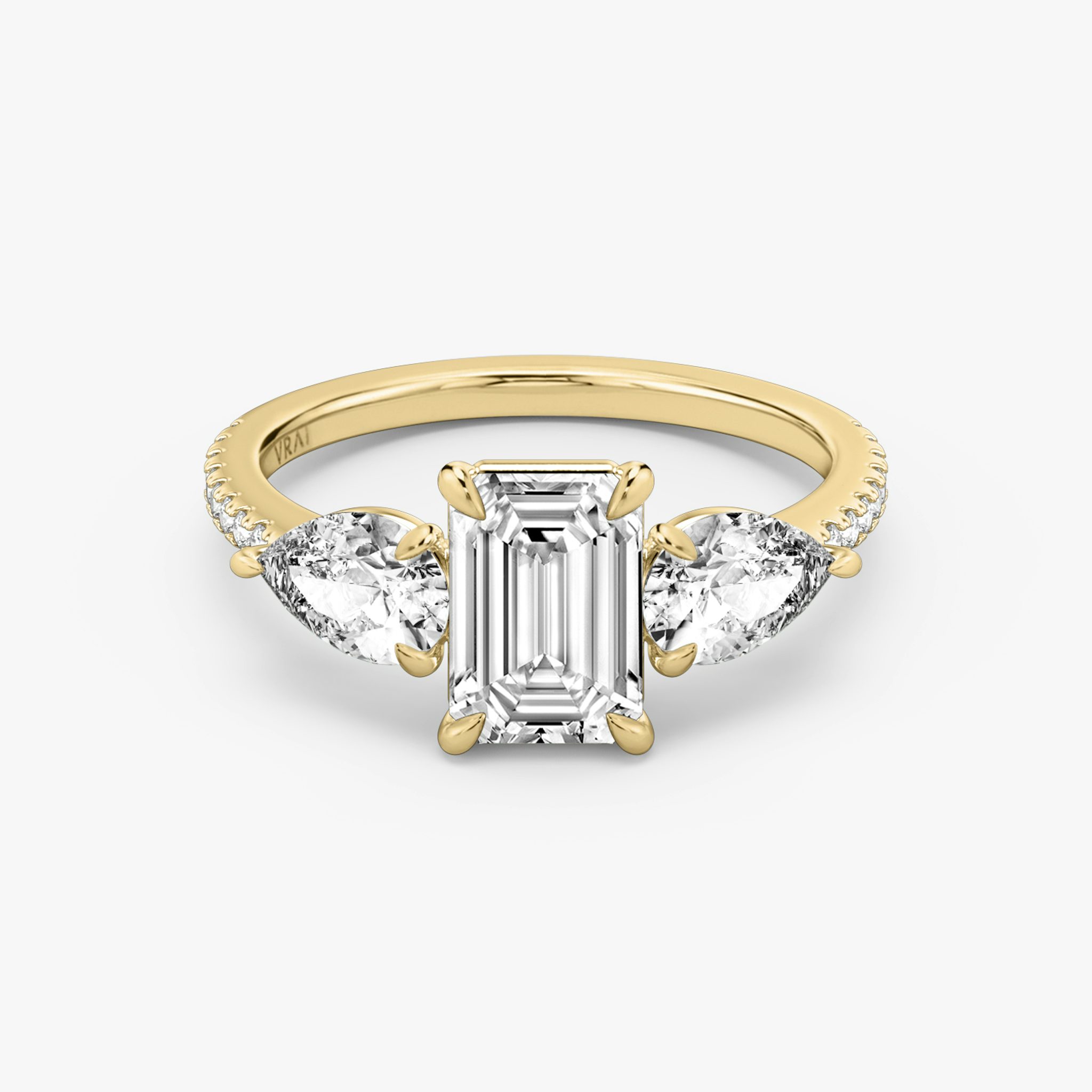 The Three Stone | Emerald | 18k | Yellow Gold | bandAccent: Pavé | sideStoneCarat: 0.50ct | sideStoneShape: Pear | diamondOrientation: vertical | caratWeight: other