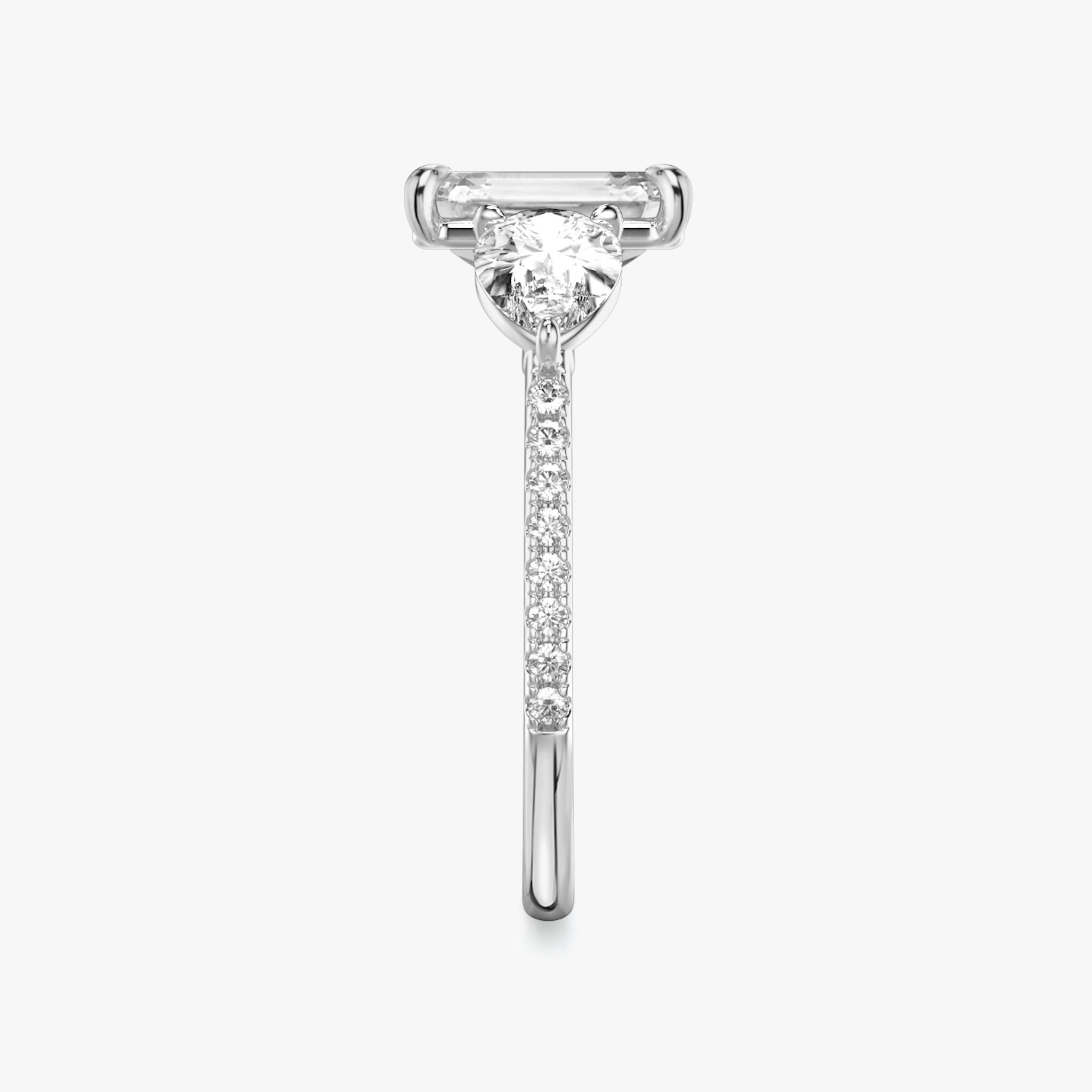 The Three Stone | Emerald | Platinum | bandAccent: Pavé | sideStoneCarat: 0.50ct | sideStoneShape: Pear | diamondOrientation: vertical | caratWeight: other