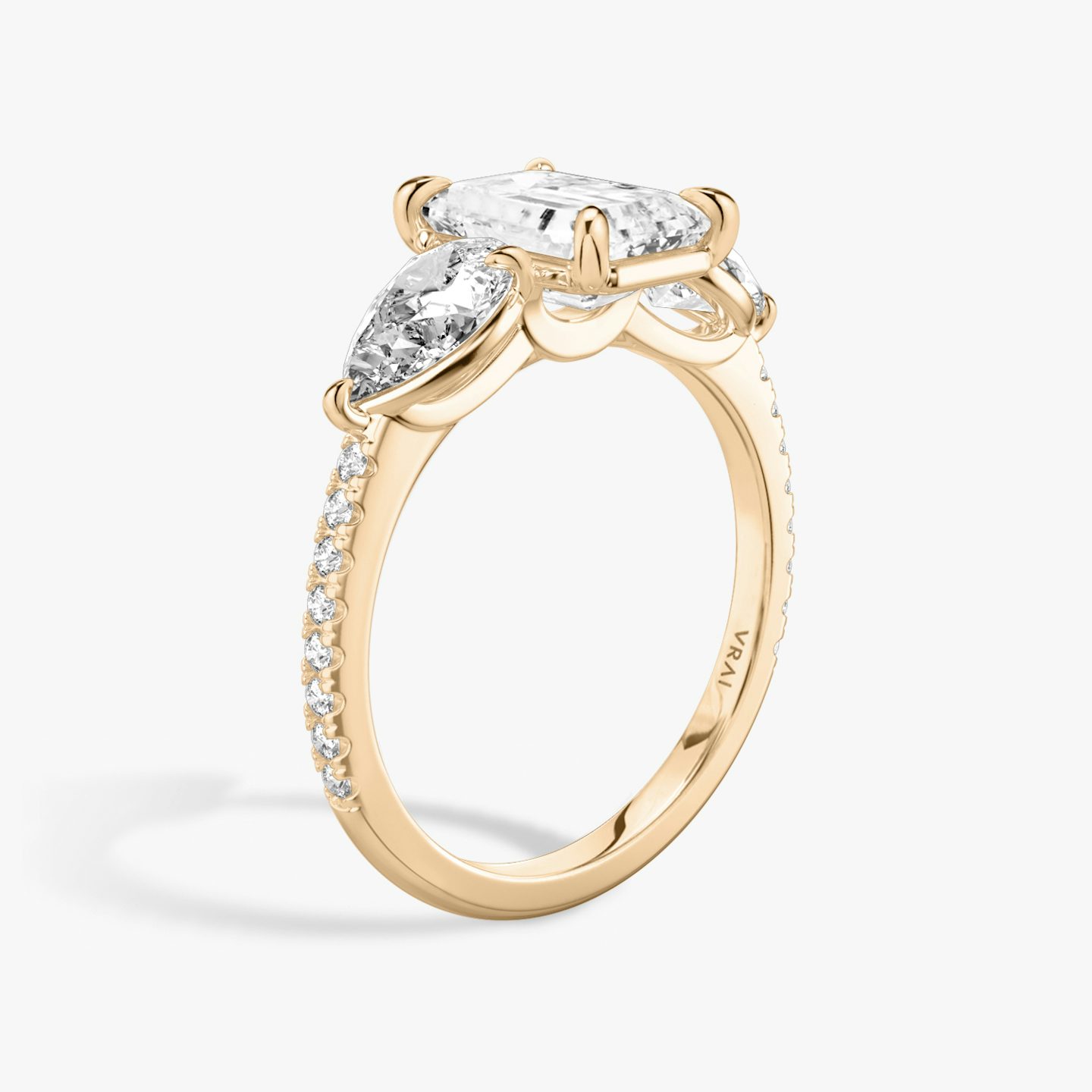 The Three Stone | Emerald | 14k | Rose Gold | bandAccent: Pavé | sideStoneCarat: 0.50ct | sideStoneShape: Pear | diamondOrientation: vertical | caratWeight: other