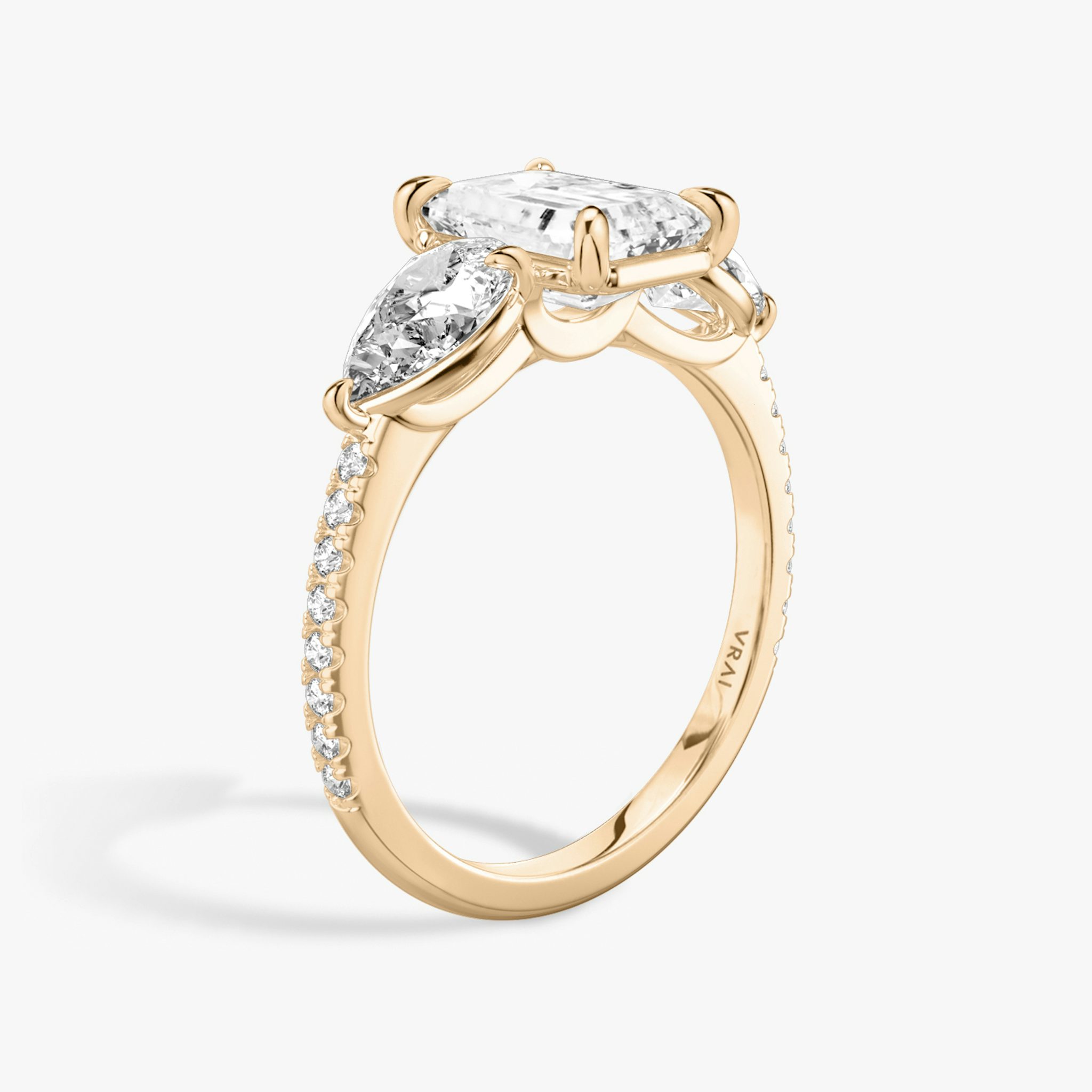 The Three Stone | Emerald | 14k | Rose Gold | bandAccent: Pavé | sideStoneCarat: 0.50ct | sideStoneShape: Pear | diamondOrientation: vertical | caratWeight: other