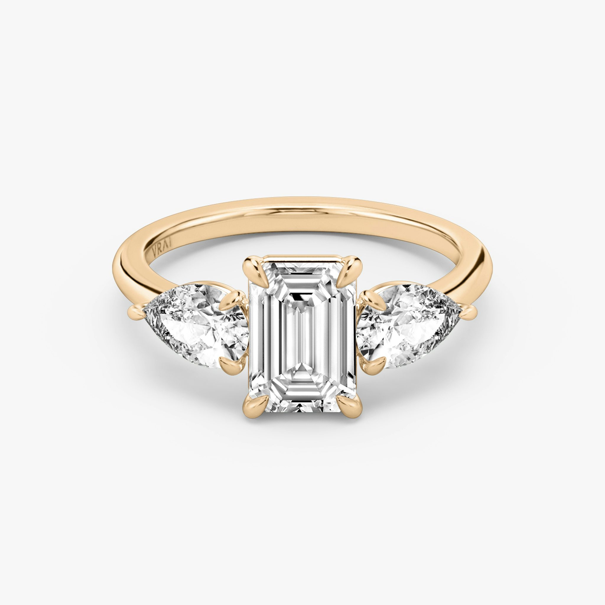 The Three Stone | Emerald | 14k | Rose Gold | bandAccent: Plain | sideStoneCarat: 0.50ct | sideStoneShape: Pear | diamondOrientation: vertical | caratWeight: other