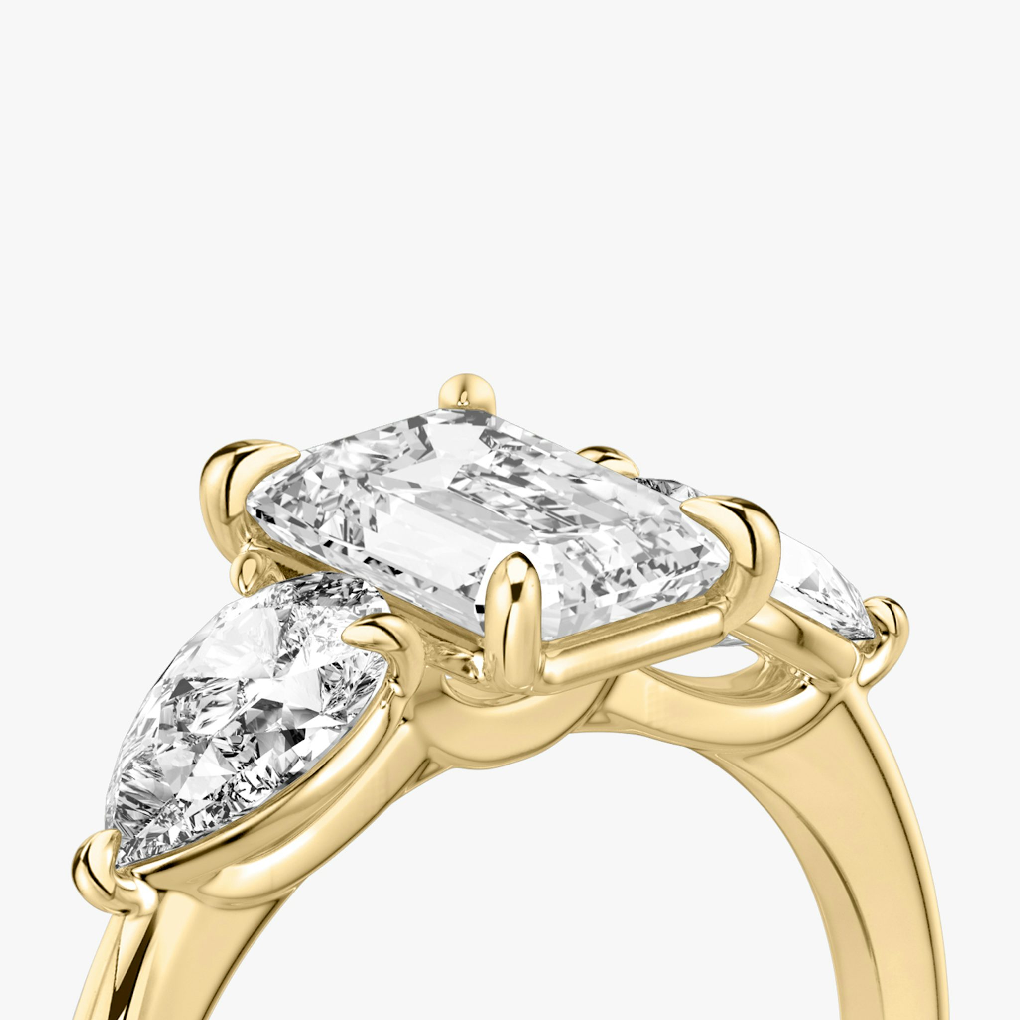 The Three Stone | Emerald | 18k | Yellow Gold | bandAccent: Plain | sideStoneCarat: 0.50ct | sideStoneShape: Pear | diamondOrientation: vertical | caratWeight: other