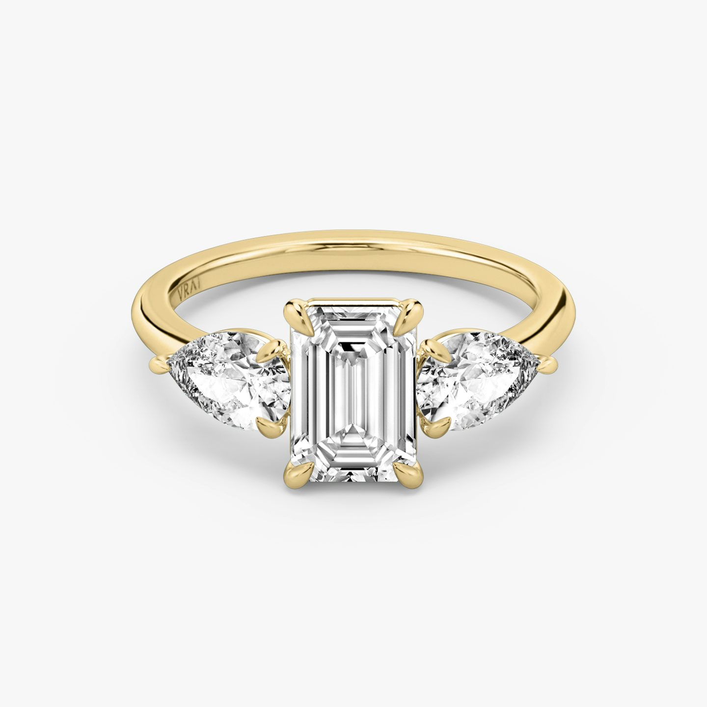 The Three Stone | Emerald | 18k | Yellow Gold | bandAccent: Plain | sideStoneCarat: 0.50ct | sideStoneShape: Pear | diamondOrientation: vertical | caratWeight: other