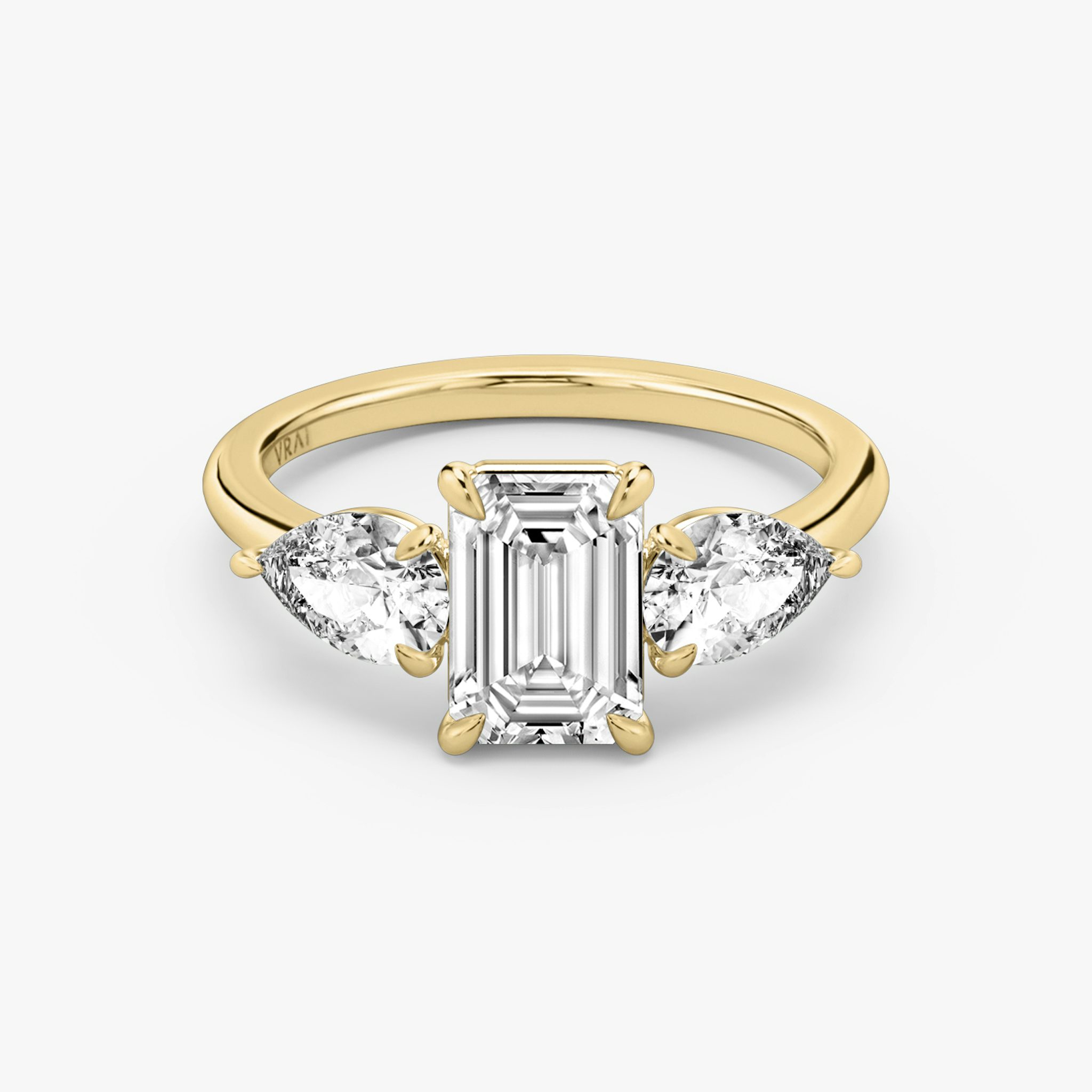 The Three Stone | Emerald | 18k | Yellow Gold | bandAccent: Plain | sideStoneCarat: 0.50ct | sideStoneShape: Pear | diamondOrientation: vertical | caratWeight: other