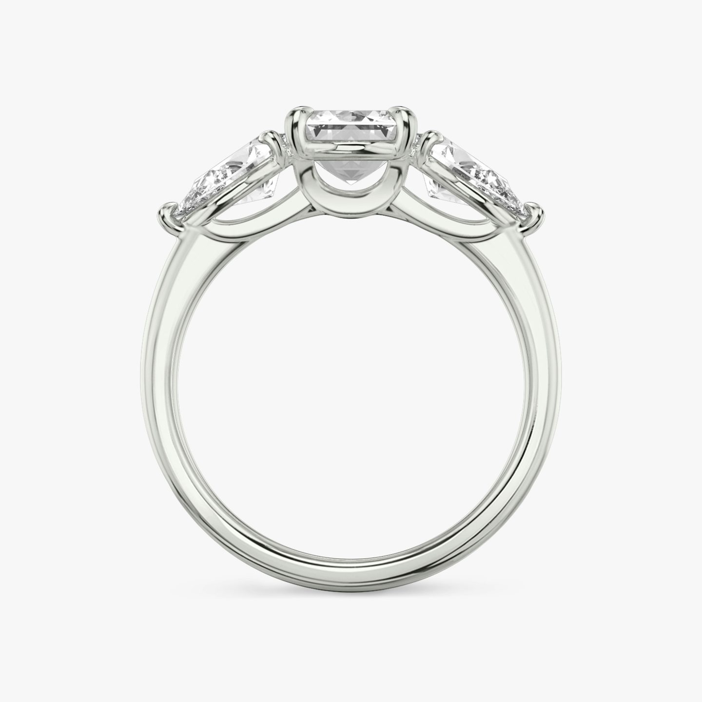 The Three Stone | Emerald | Platinum | bandAccent: Plain | sideStoneCarat: 0.50ct | sideStoneShape: Pear | diamondOrientation: vertical | caratWeight: other
