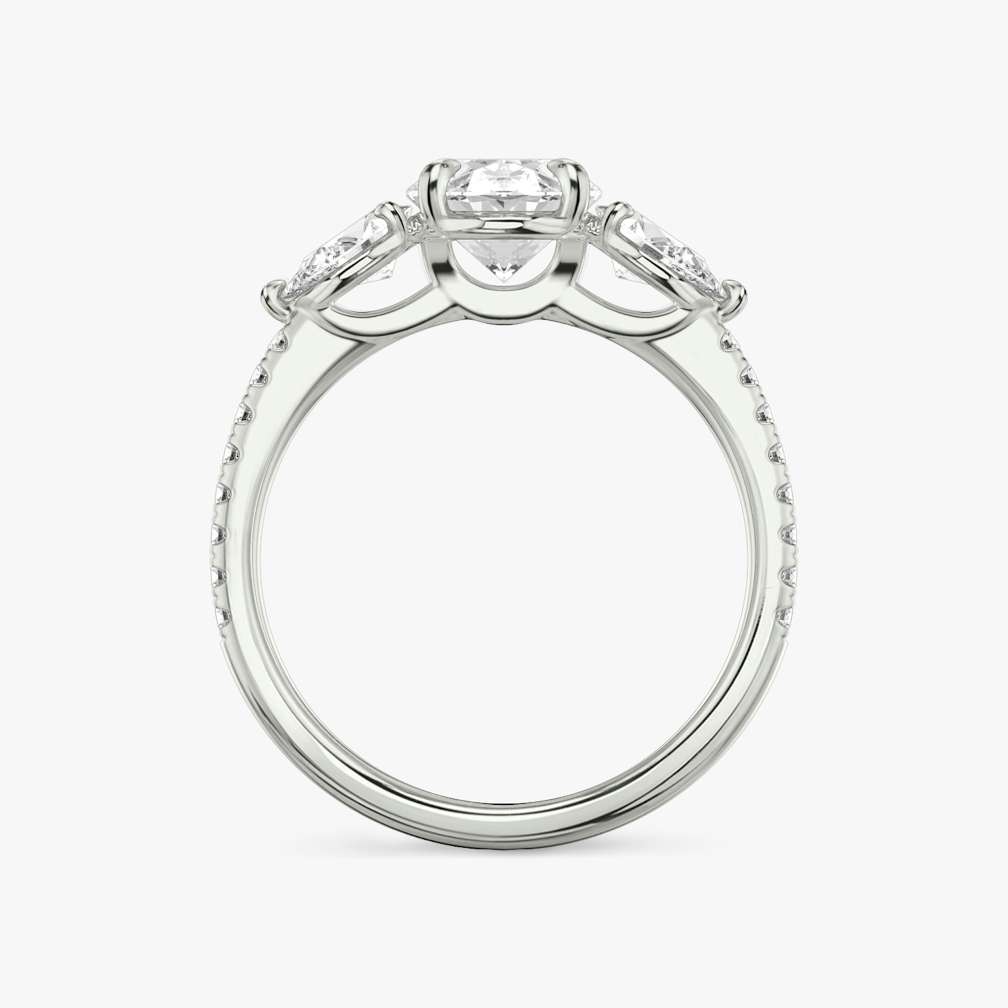The Three Stone | Oval | 18k | White Gold | bandAccent: Pavé | sideStoneCarat: 0.25ct | sideStoneShape: Pear | diamondOrientation: vertical | caratWeight: other