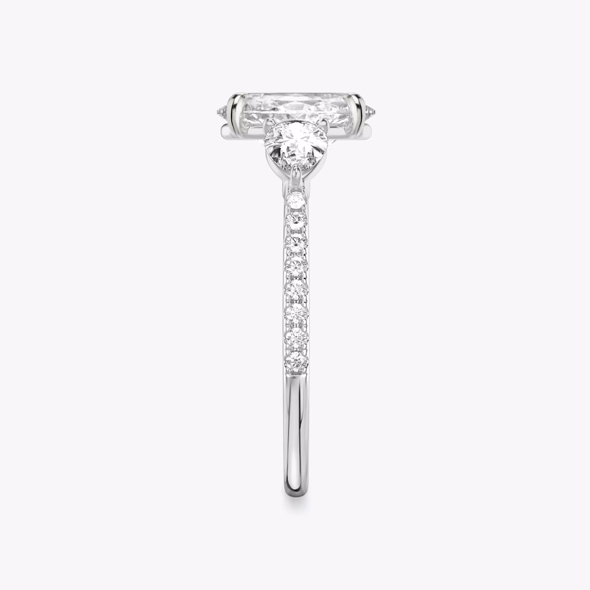 The Three Stone | Oval | 18k | White Gold | bandAccent: Pavé | sideStoneCarat: 0.25ct | sideStoneShape: Pear | diamondOrientation: vertical | caratWeight: other