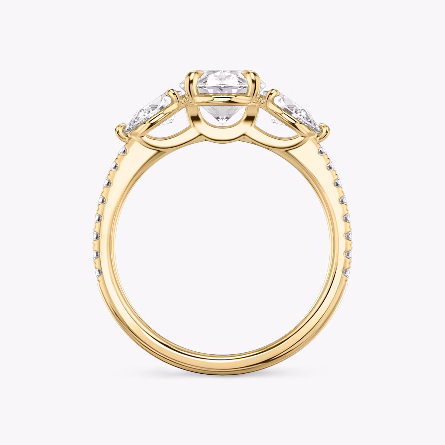 The Three Stone | Oval | 18k | Yellow Gold | bandAccent: Pavé | sideStoneCarat: 0.25ct | sideStoneShape: Pear | diamondOrientation: vertical | caratWeight: other