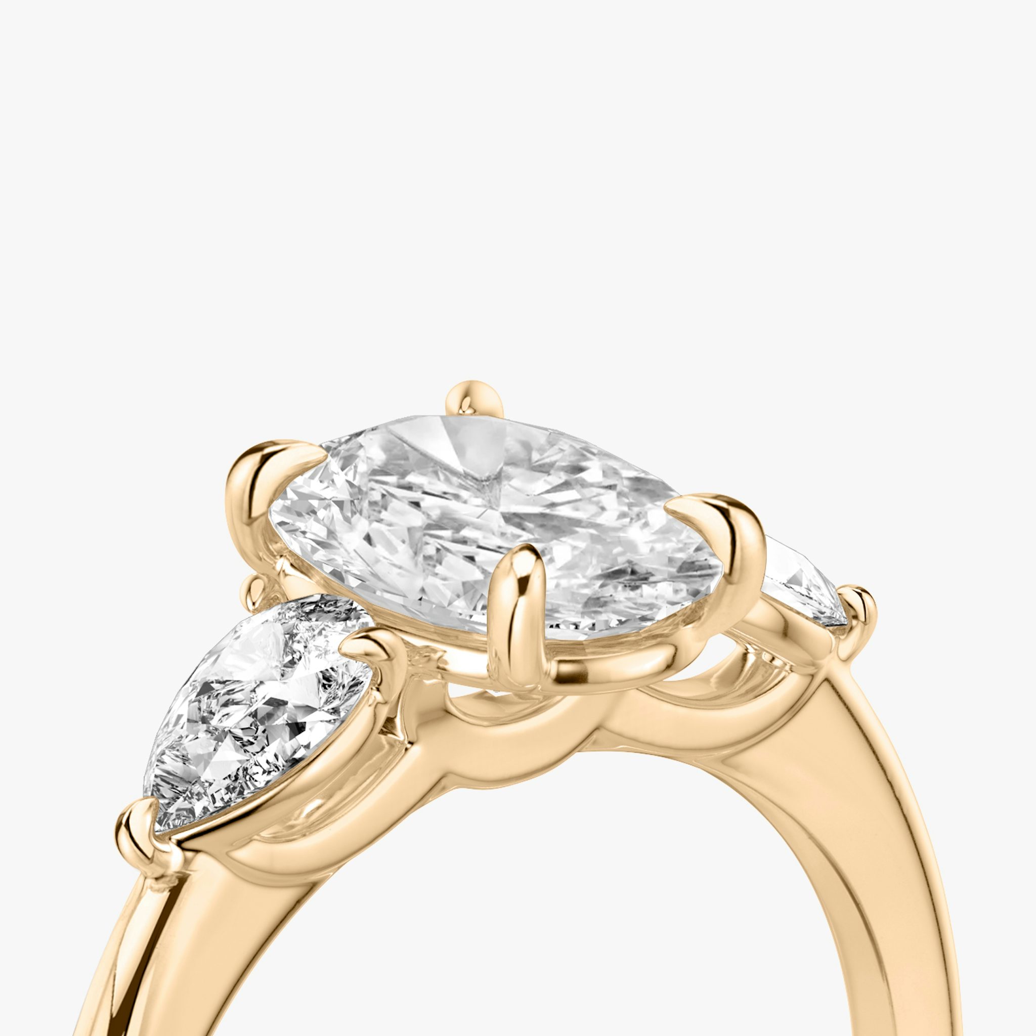 The Three Stone | Oval | 14k | Rose Gold | bandAccent: Plain | sideStoneCarat: 0.25ct | sideStoneShape: Pear | diamondOrientation: vertical | caratWeight: other