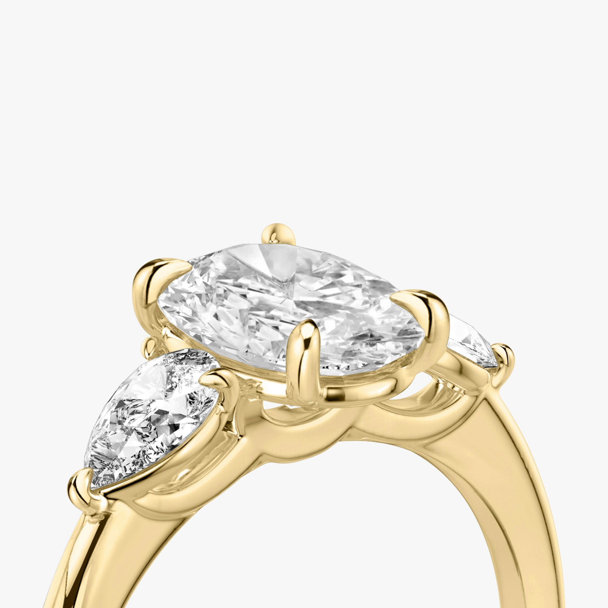 The Three Stone | Oval | 18k | Yellow Gold | bandAccent: Plain | sideStoneCarat: 0.25ct | sideStoneShape: Pear | diamondOrientation: vertical | caratWeight: other