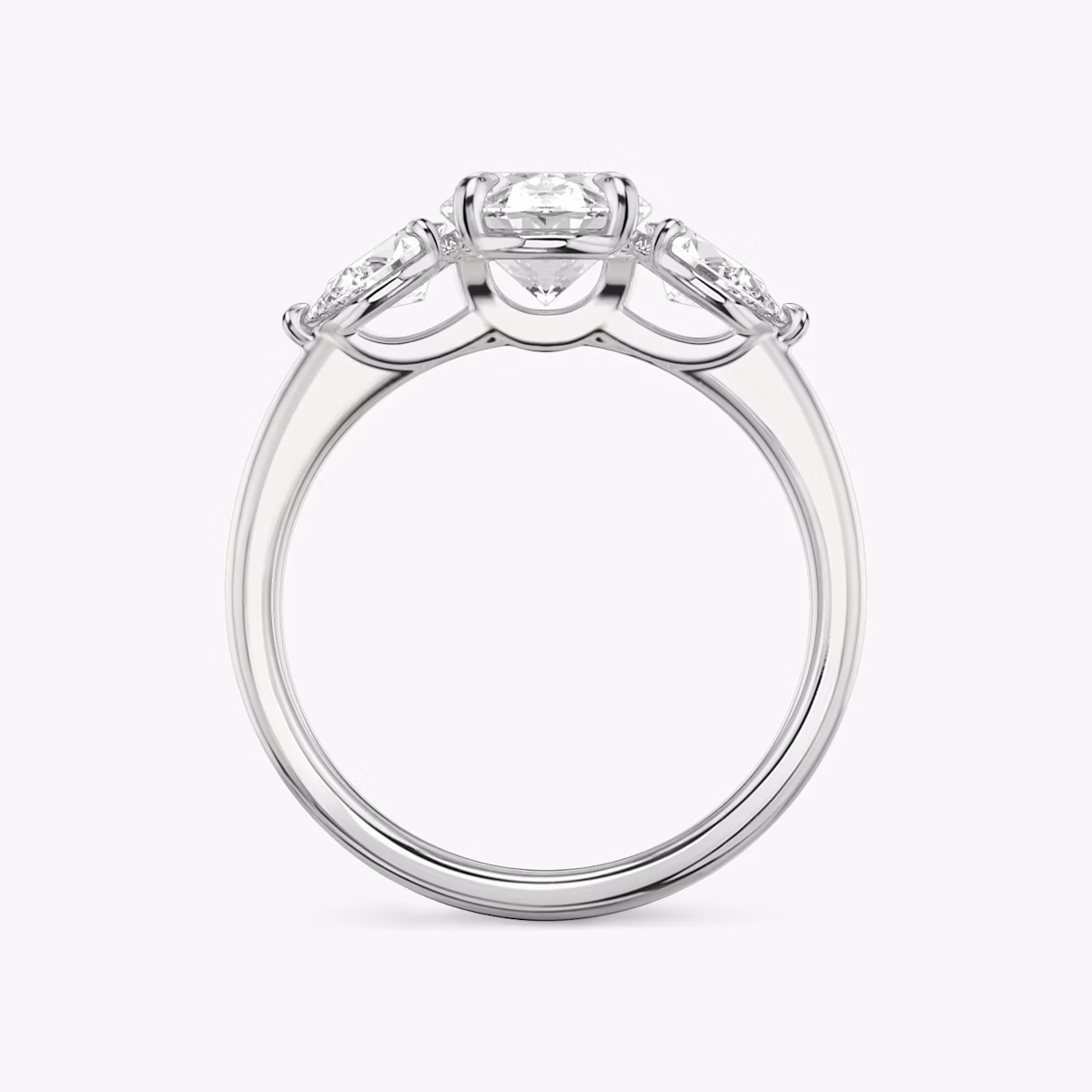 The Three Stone | Oval | Platinum | bandAccent: Plain | sideStoneCarat: 0.25ct | sideStoneShape: Pear | diamondOrientation: vertical | caratWeight: other