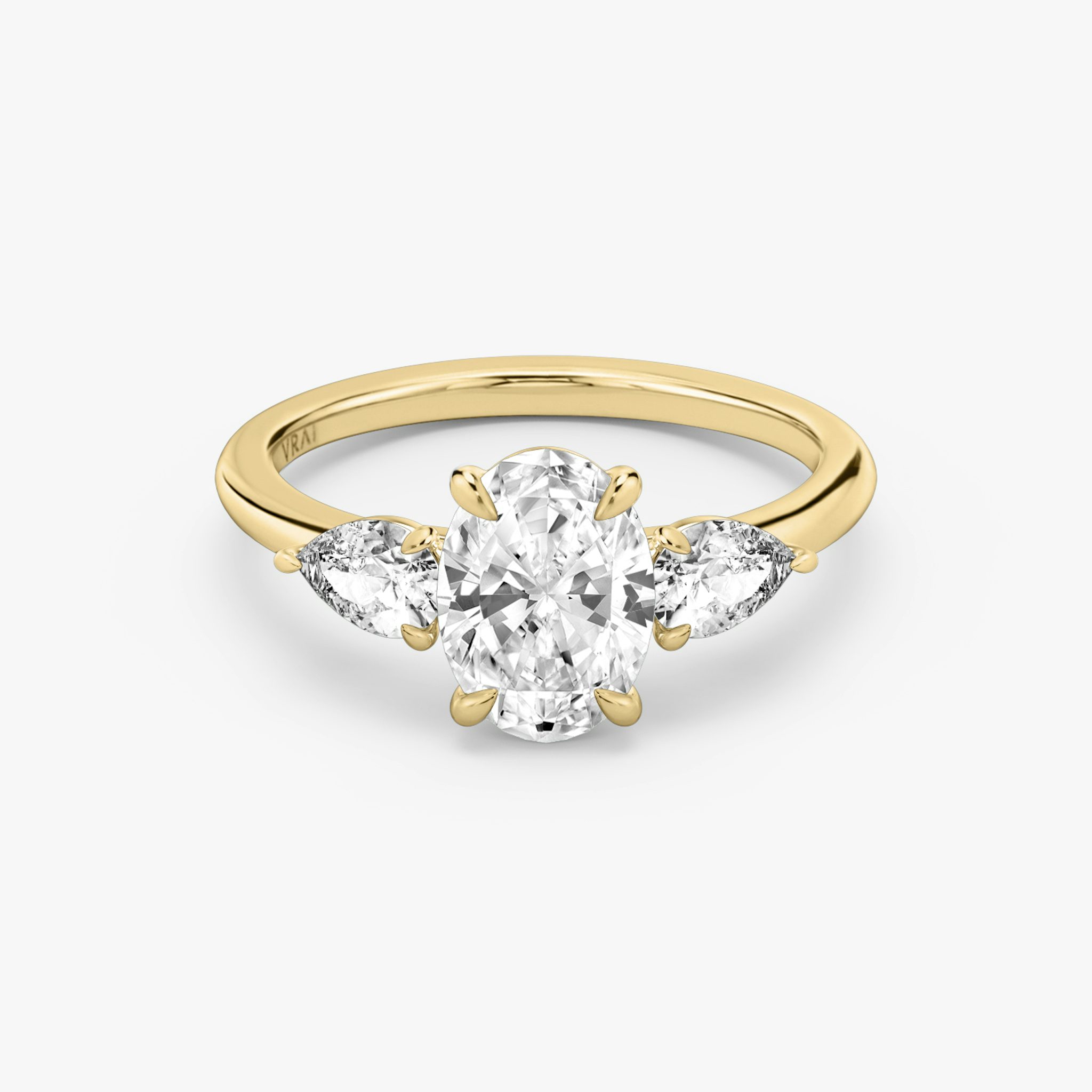 The Three Stone | Oval | 18k | Yellow Gold | bandAccent: Plain | sideStoneCarat: 0.25ct | sideStoneShape: Pear | diamondOrientation: vertical | caratWeight: other