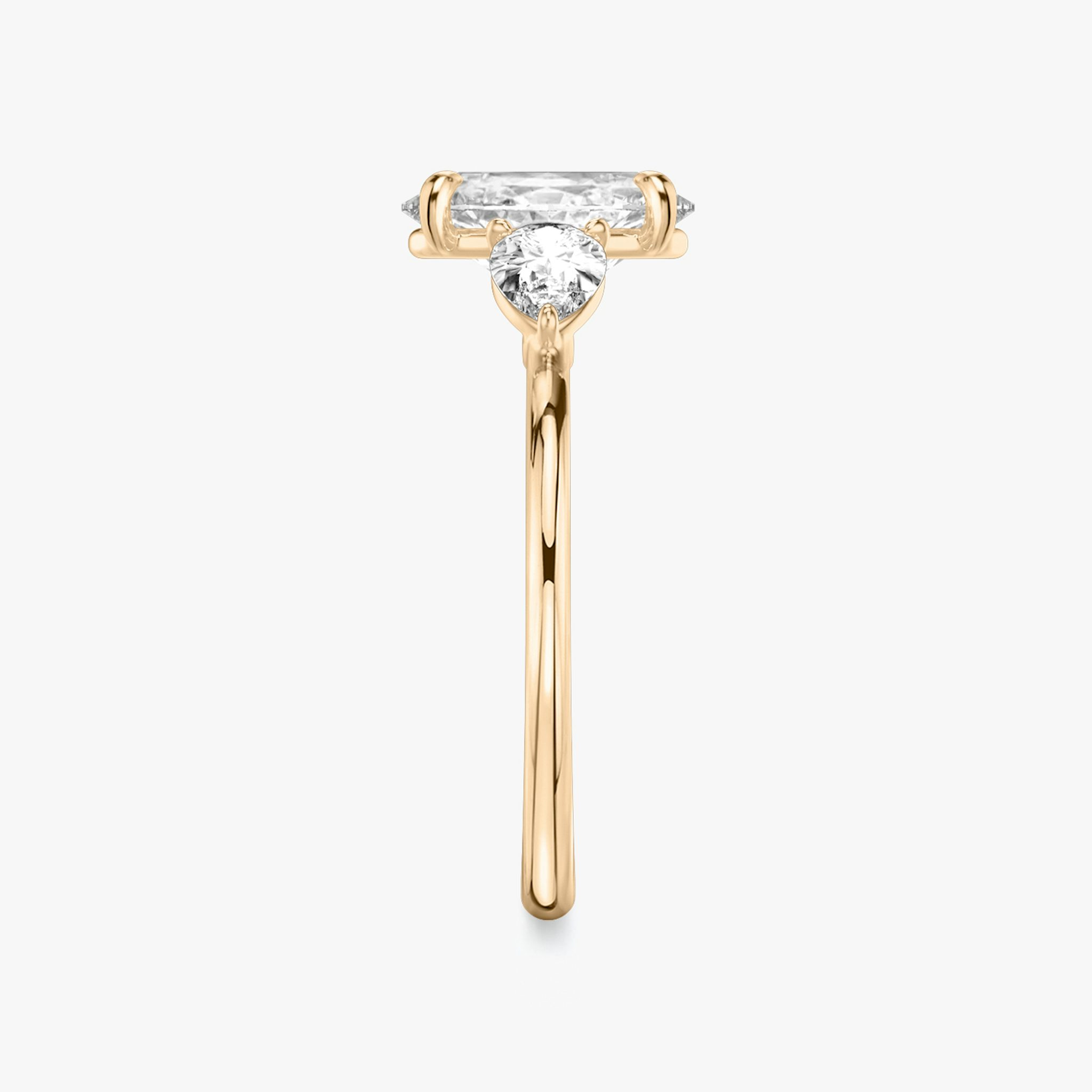 The Three Stone | Oval | 14k | Rose Gold | bandAccent: Plain | sideStoneCarat: 0.25ct | sideStoneShape: Pear | diamondOrientation: vertical | caratWeight: other