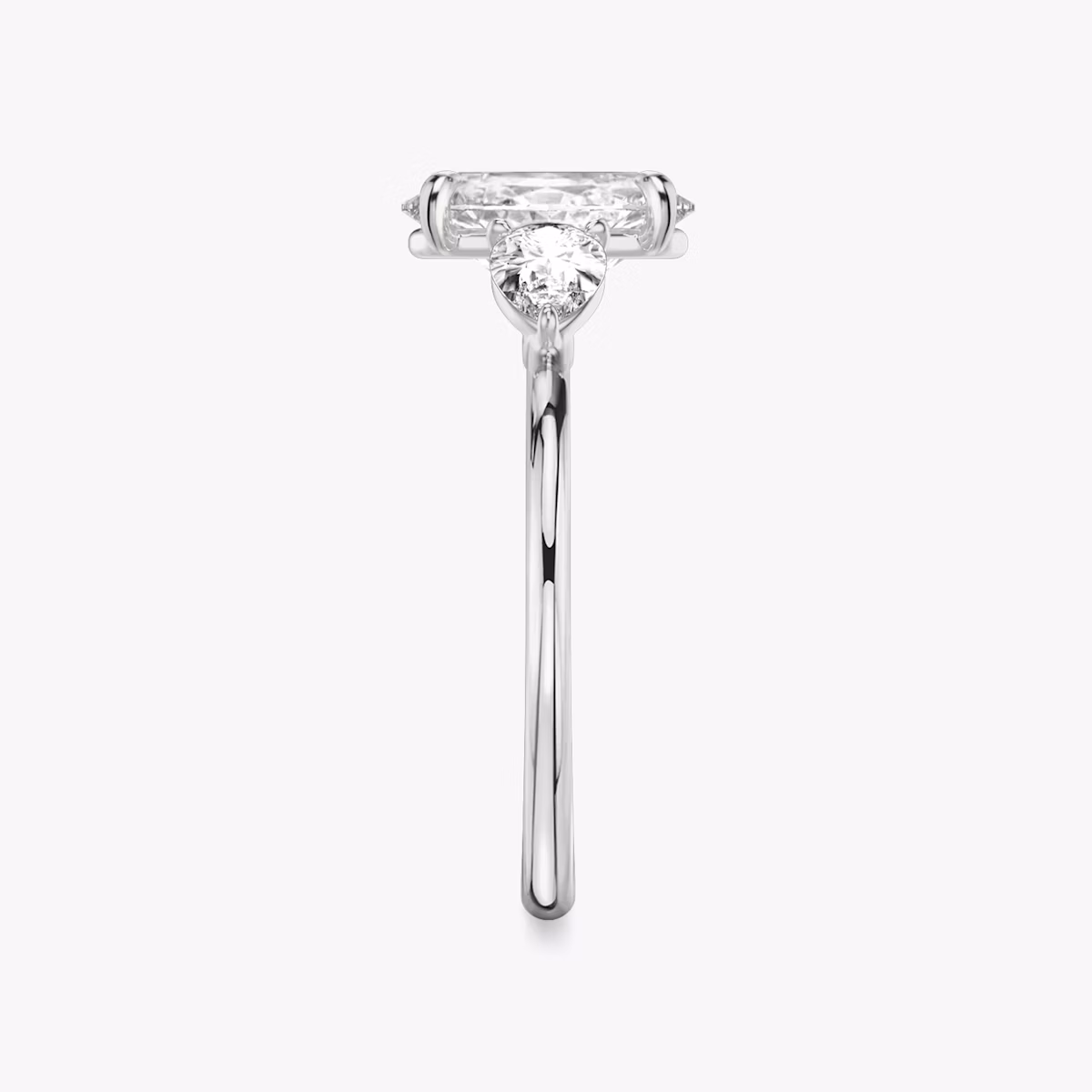 The Three Stone | Oval | Platinum | bandAccent: Plain | sideStoneCarat: 0.25ct | sideStoneShape: Pear | diamondOrientation: vertical | caratWeight: other