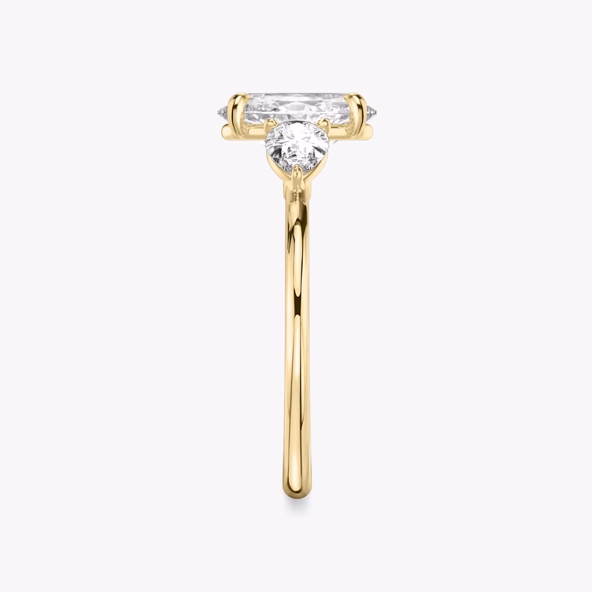 The Three Stone | Oval | 18k | Yellow Gold | bandAccent: Plain | sideStoneCarat: 0.25ct | sideStoneShape: Pear | diamondOrientation: vertical | caratWeight: other
