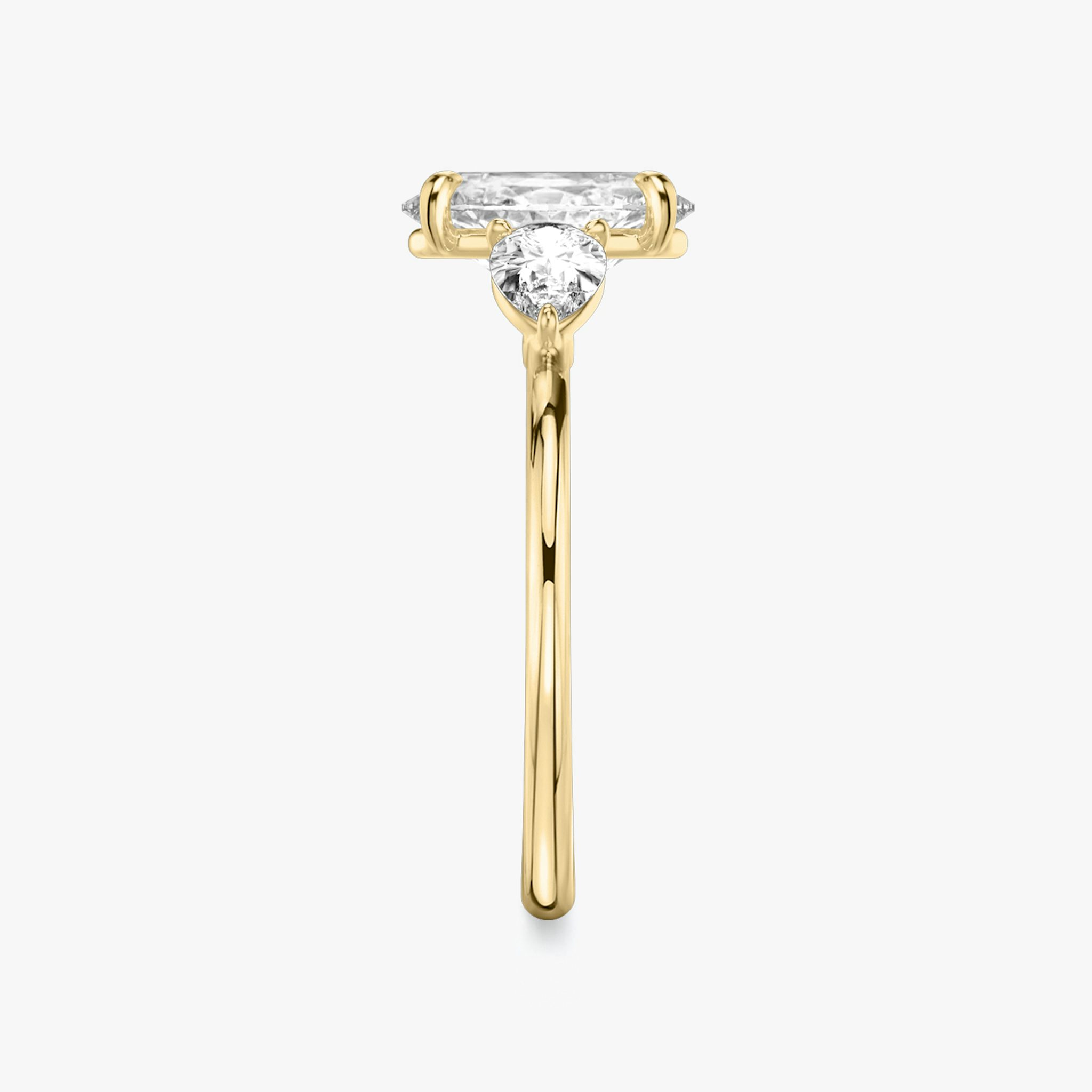 The Three Stone | Oval | 18k | Yellow Gold | bandAccent: Plain | sideStoneCarat: 0.25ct | sideStoneShape: Pear | diamondOrientation: vertical | caratWeight: other