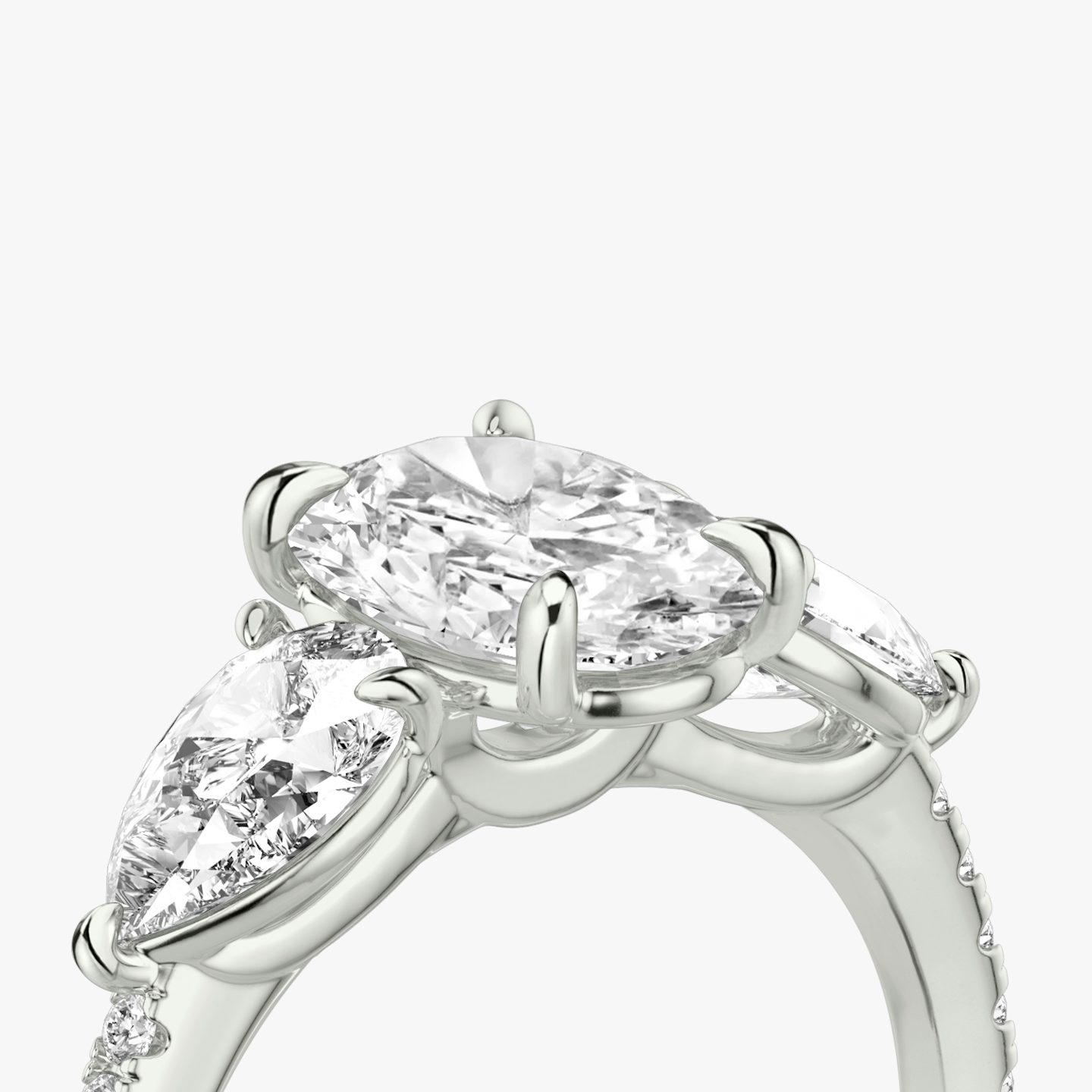 The Three Stone | Oval | Platinum | bandAccent: Pavé | sideStoneCarat: 0.50ct | sideStoneShape: Pear | diamondOrientation: vertical | caratWeight: other