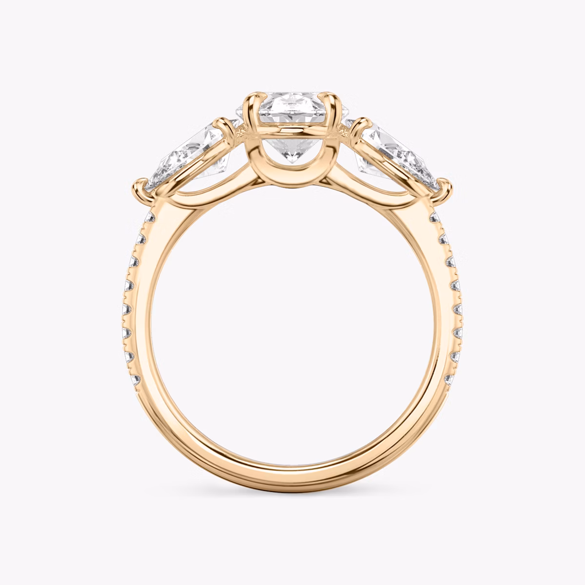 The Three Stone | Oval | 14k | Rose Gold | bandAccent: Pavé | sideStoneCarat: 0.50ct | sideStoneShape: Pear | diamondOrientation: vertical | caratWeight: other