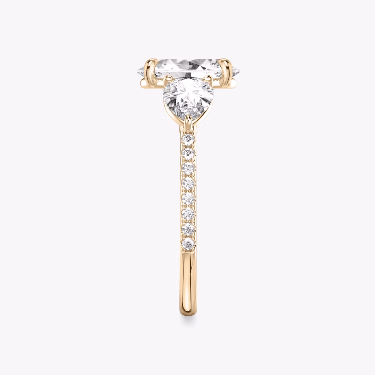 The Three Stone | Oval | 14k | Rose Gold | bandAccent: Pavé | sideStoneCarat: 0.50ct | sideStoneShape: Pear | diamondOrientation: vertical | caratWeight: other