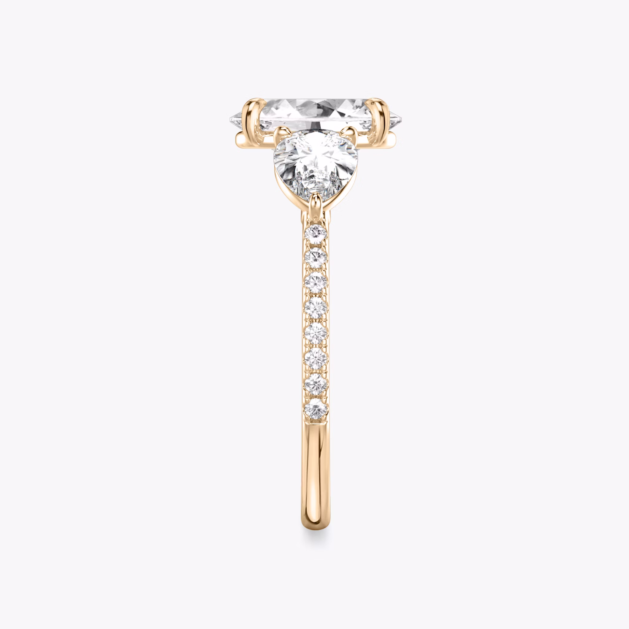 The Three Stone | Oval | 14k | Rose Gold | bandAccent: Pavé | sideStoneCarat: 0.50ct | sideStoneShape: Pear | diamondOrientation: vertical | caratWeight: other