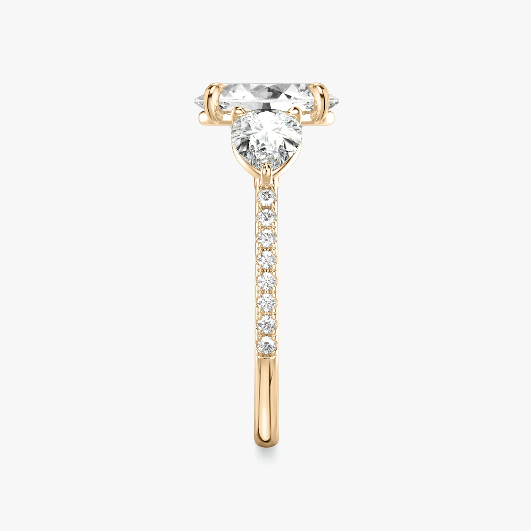 The Three Stone | Oval | 14k | Rose Gold | bandAccent: Pavé | sideStoneCarat: 0.50ct | sideStoneShape: Pear | diamondOrientation: vertical | caratWeight: other