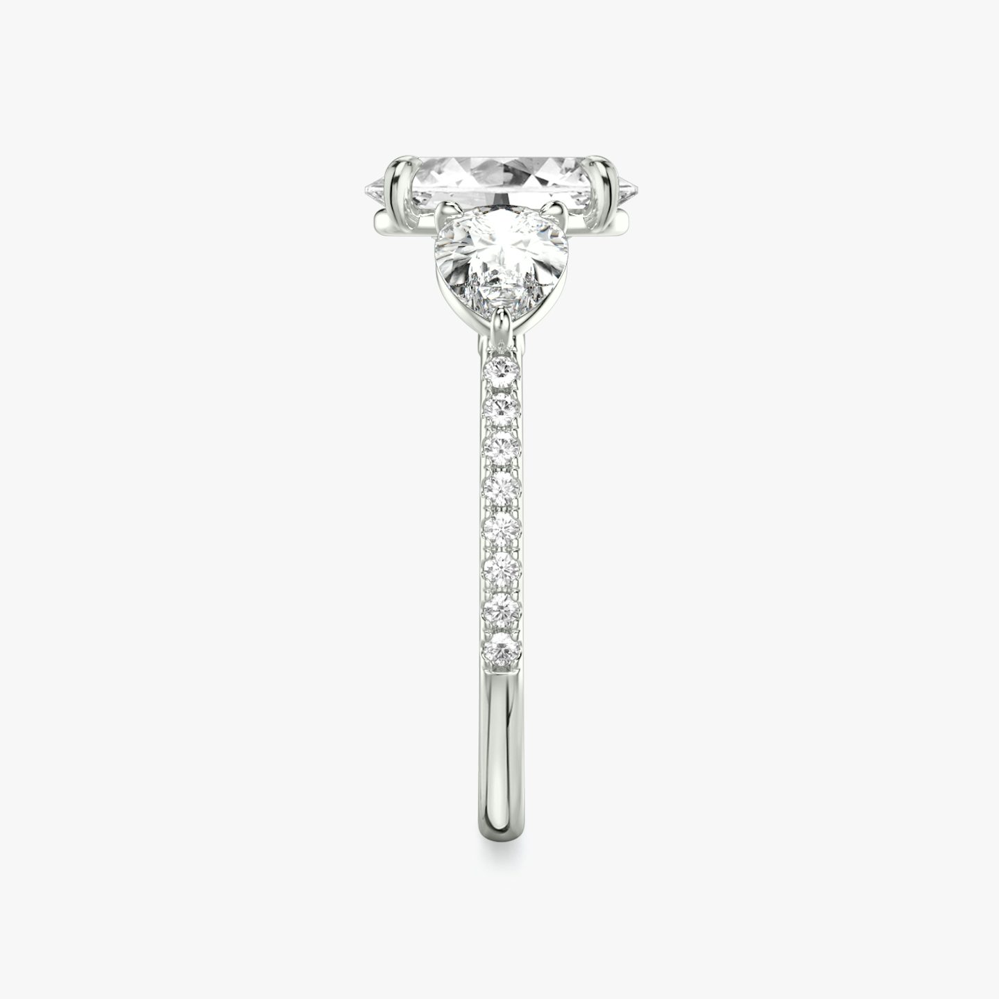 The Three Stone | Oval | Platinum | bandAccent: Pavé | sideStoneCarat: 0.50ct | sideStoneShape: Pear | diamondOrientation: vertical | caratWeight: other