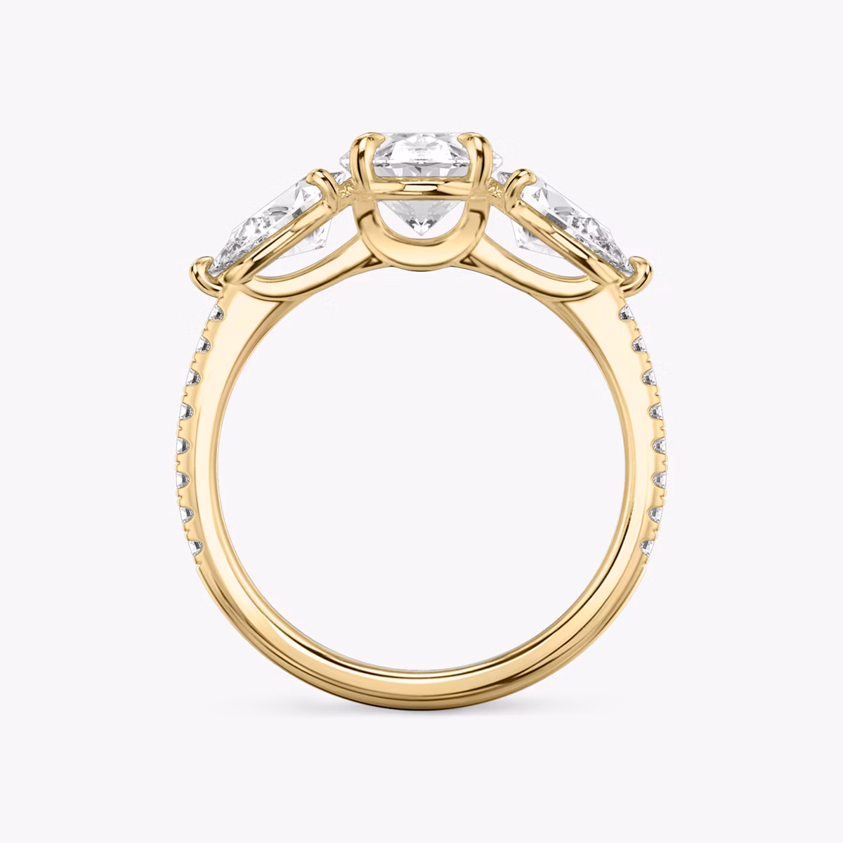 The Three Stone | Oval | 18k | Yellow Gold | bandAccent: Pavé | sideStoneCarat: 0.50ct | sideStoneShape: Pear | diamondOrientation: vertical | caratWeight: other