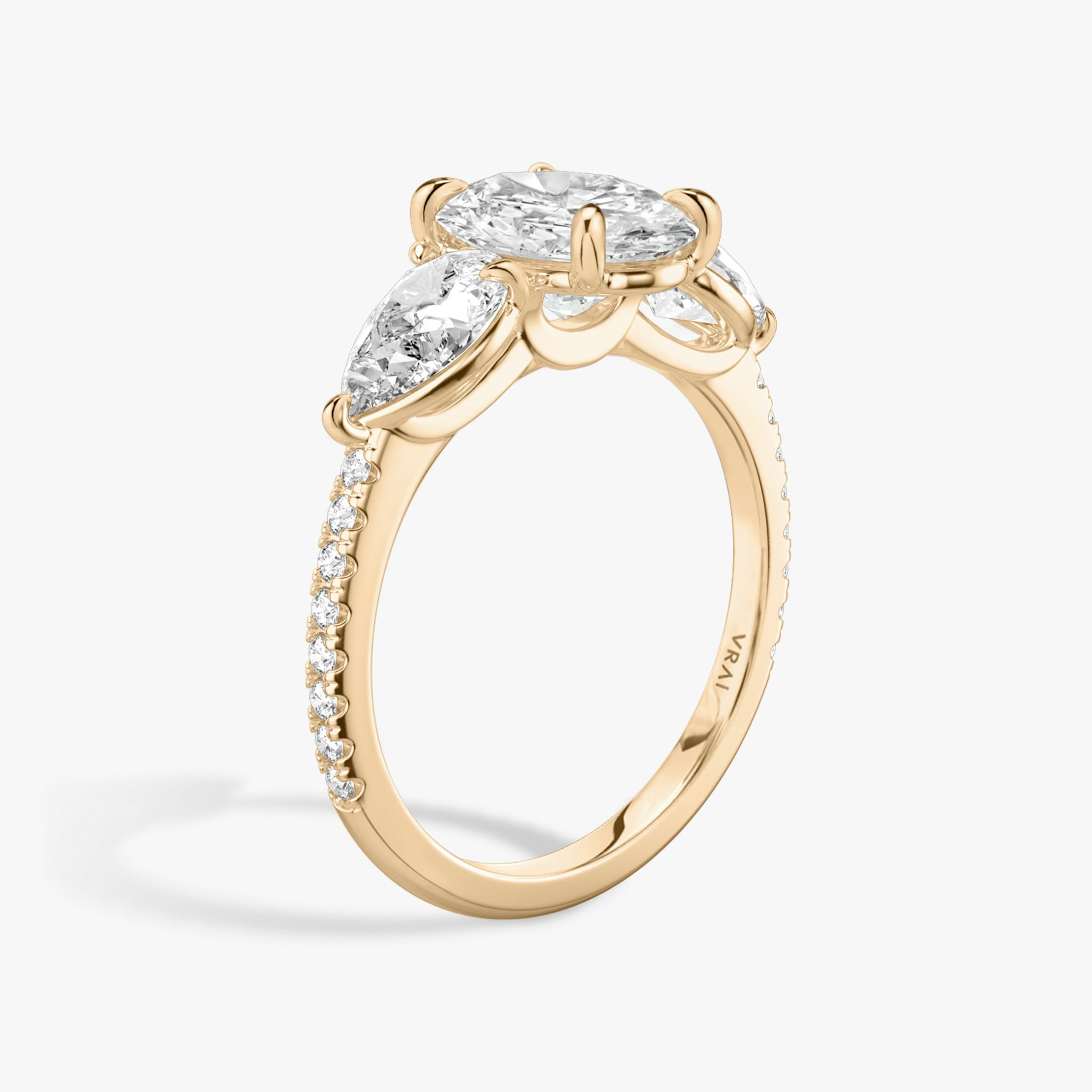 The Three Stone | Oval | 14k | Rose Gold | bandAccent: Pavé | sideStoneCarat: 0.50ct | sideStoneShape: Pear | diamondOrientation: vertical | caratWeight: other