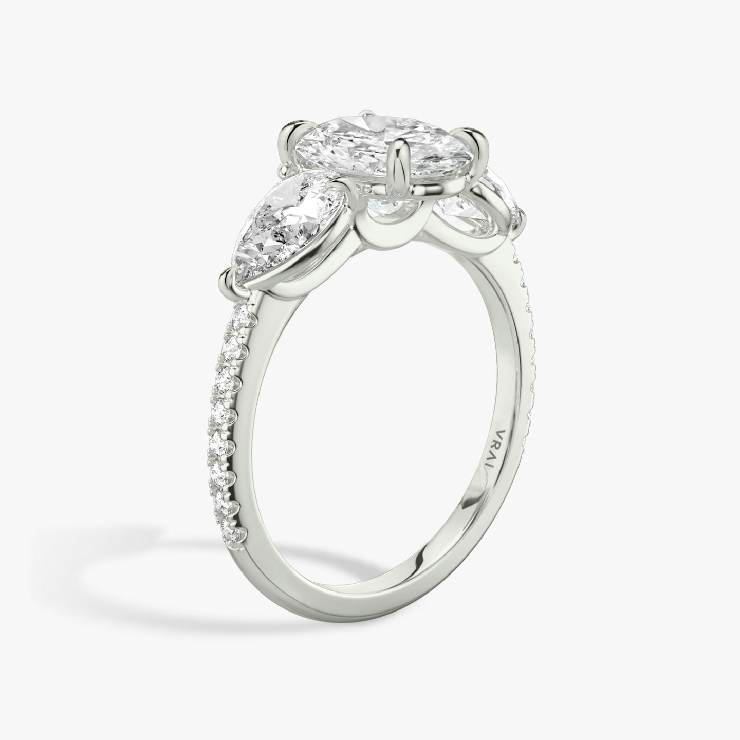 The Three Stone | Oval | Platinum | bandAccent: Pavé | sideStoneCarat: 0.50ct | sideStoneShape: Pear | diamondOrientation: vertical | caratWeight: other