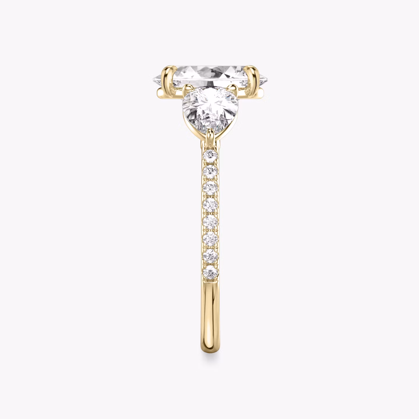 The Three Stone | Oval | 18k | Yellow Gold | bandAccent: Pavé | sideStoneCarat: 0.50ct | sideStoneShape: Pear | diamondOrientation: vertical | caratWeight: other