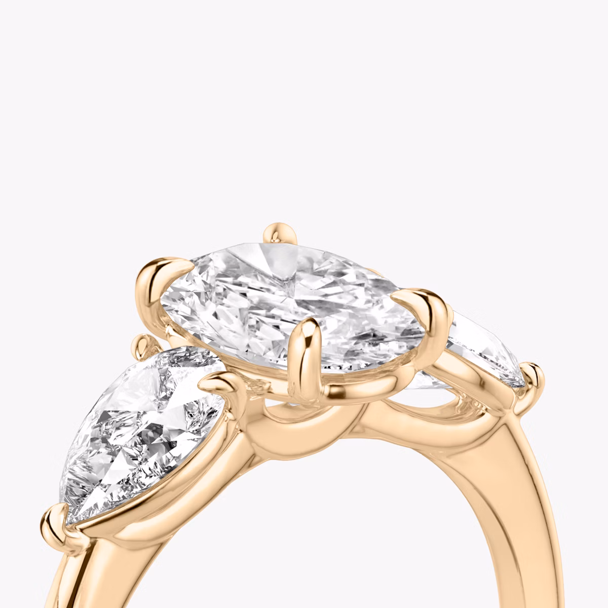 The Three Stone | Oval | 14k | Rose Gold | bandAccent: Plain | sideStoneCarat: 0.50ct | sideStoneShape: Pear | diamondOrientation: vertical | caratWeight: other