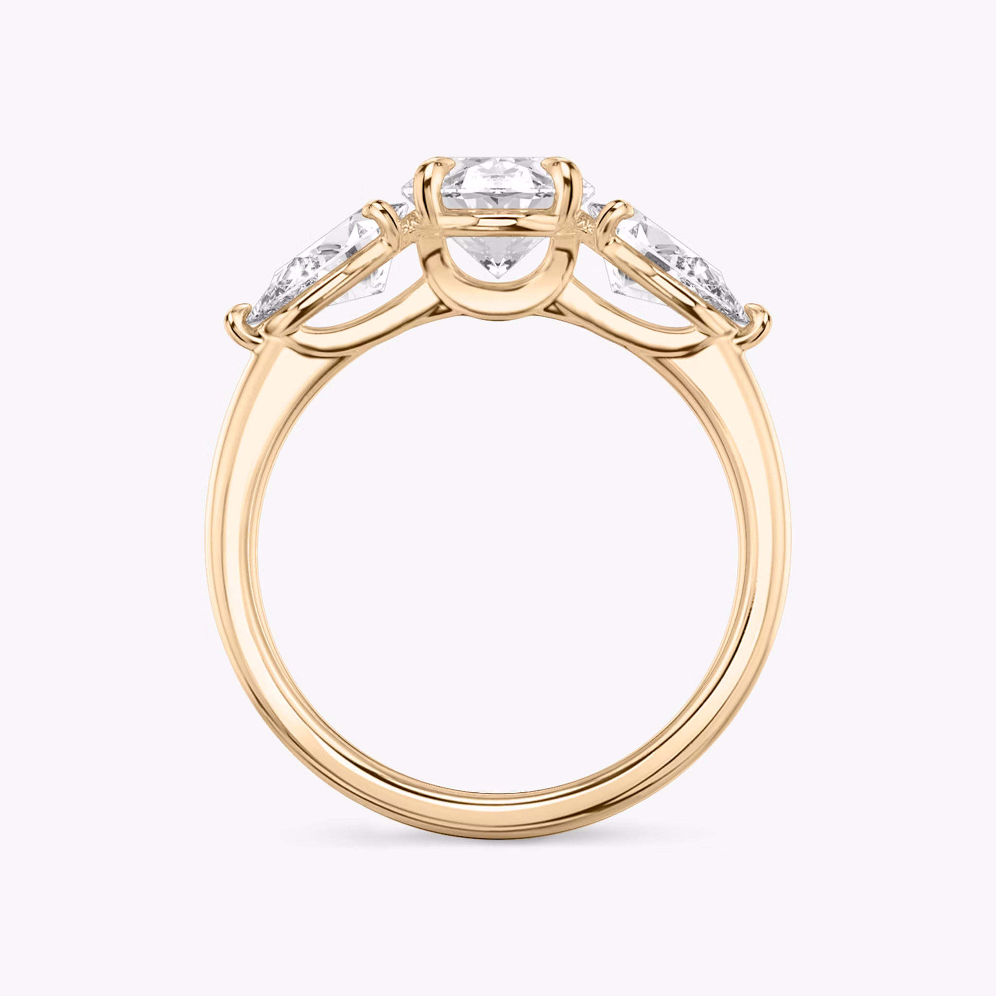 The Three Stone | Oval | 14k | Rose Gold | bandAccent: Plain | sideStoneCarat: 0.50ct | sideStoneShape: Pear | diamondOrientation: vertical | caratWeight: other
