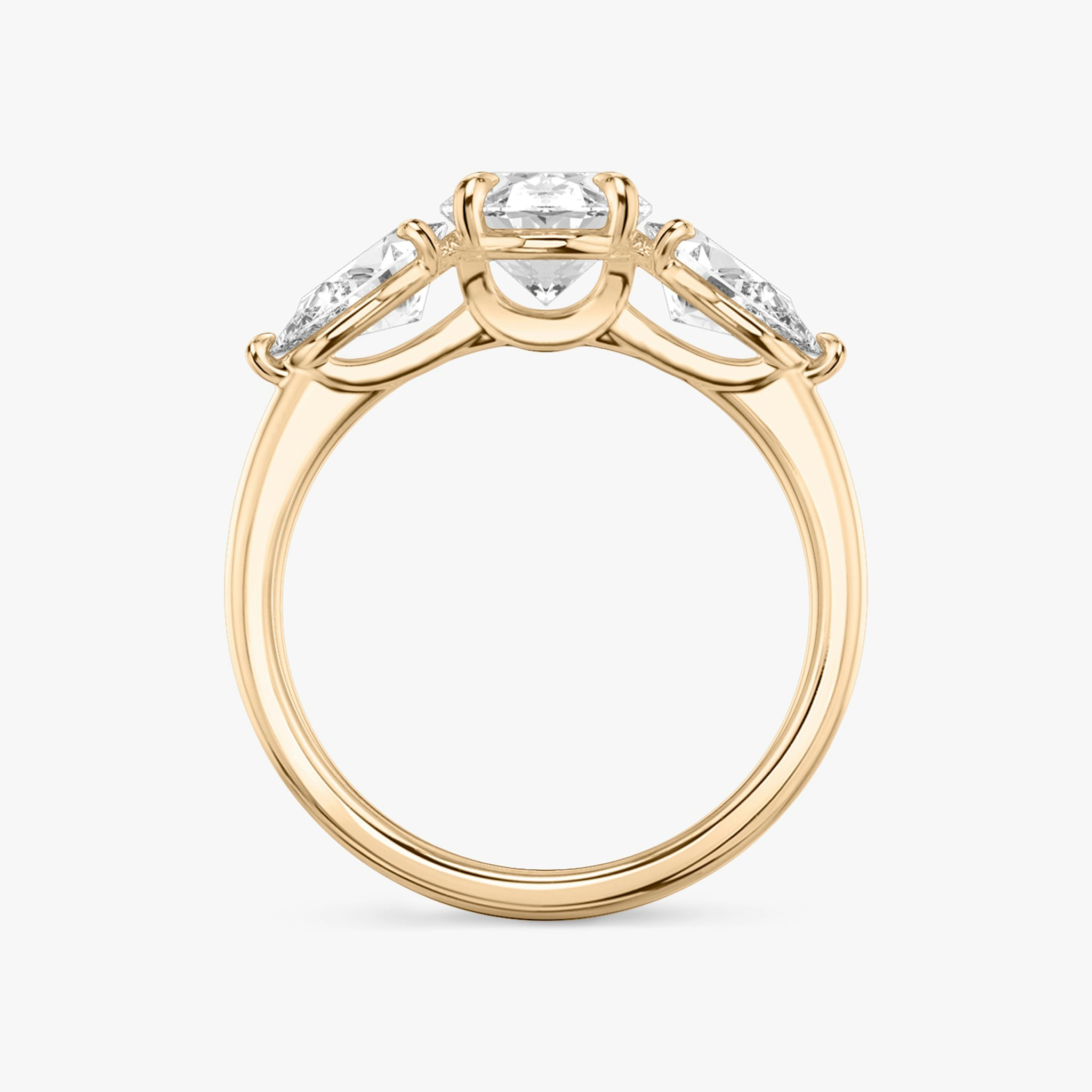 The Three Stone | Oval | 14k | Rose Gold | bandAccent: Plain | sideStoneCarat: 0.50ct | sideStoneShape: Pear | diamondOrientation: vertical | caratWeight: other