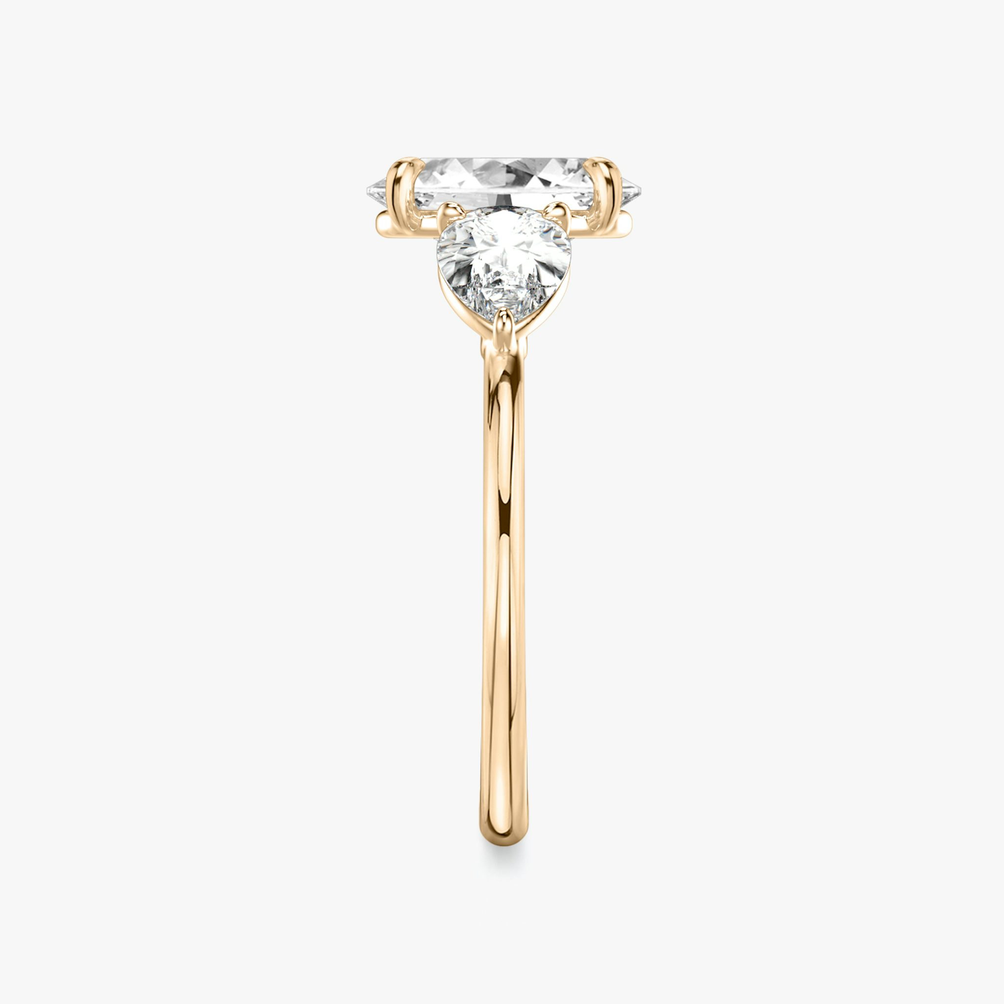 The Three Stone | Oval | 14k | Rose Gold | bandAccent: Plain | sideStoneCarat: 0.50ct | sideStoneShape: Pear | diamondOrientation: vertical | caratWeight: other