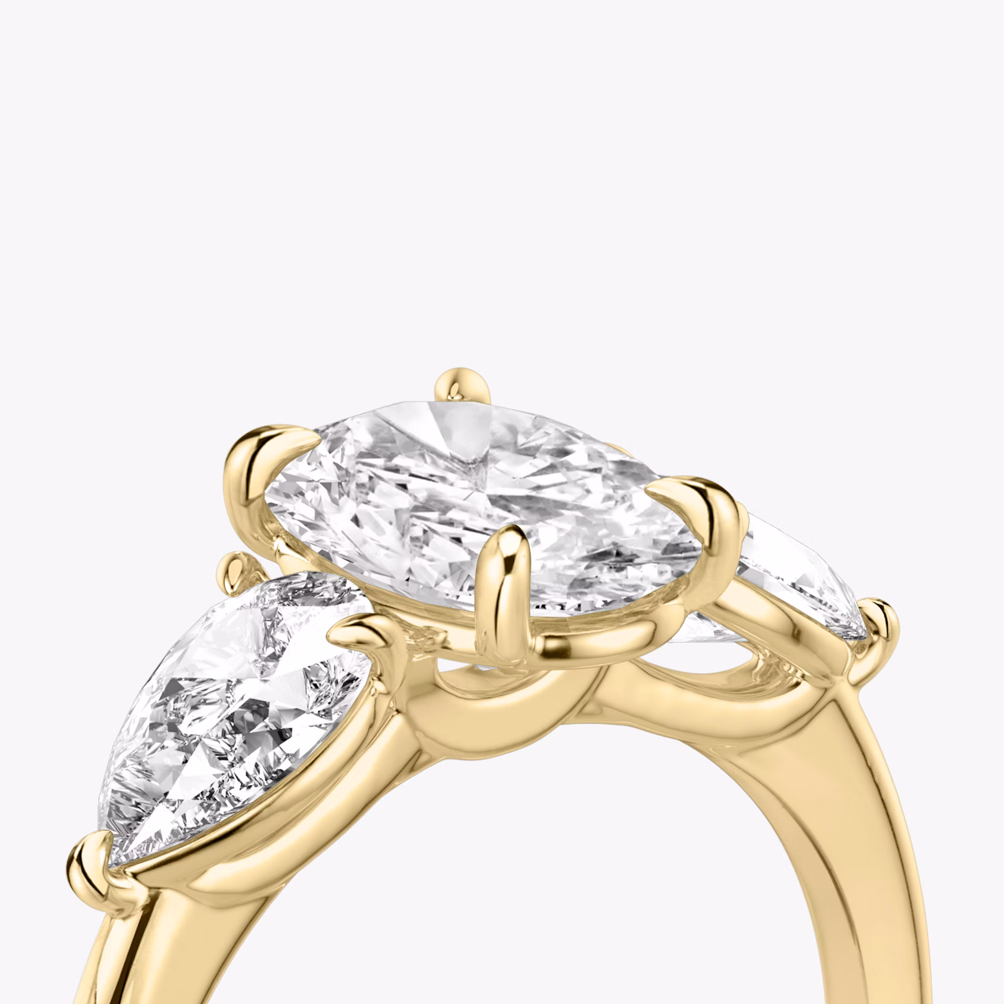 The Three Stone | Oval | 18k | Yellow Gold | bandAccent: Plain | sideStoneCarat: 0.50ct | sideStoneShape: Pear | diamondOrientation: vertical | caratWeight: other
