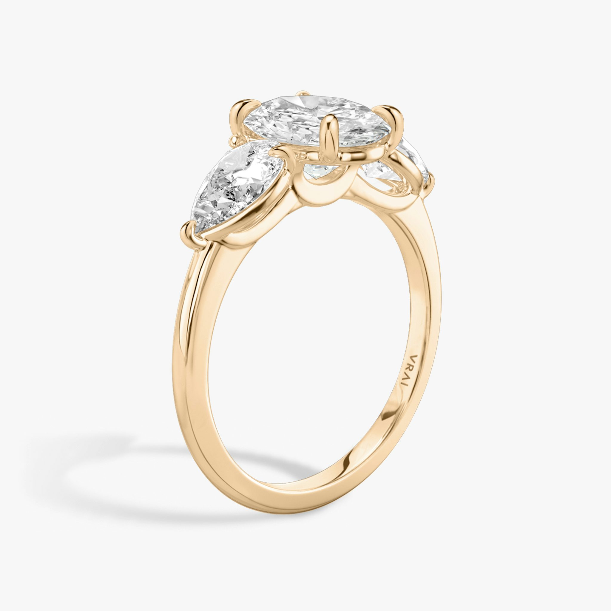 The Three Stone | Oval | 14k | Rose Gold | bandAccent: Plain | sideStoneCarat: 0.50ct | sideStoneShape: Pear | diamondOrientation: vertical | caratWeight: other