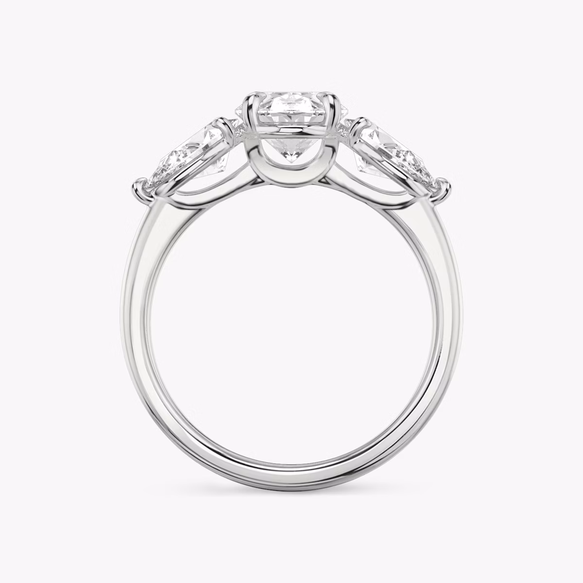 The Three Stone | Oval | Platinum | bandAccent: Plain | sideStoneCarat: 0.50ct | sideStoneShape: Pear | diamondOrientation: vertical | caratWeight: other