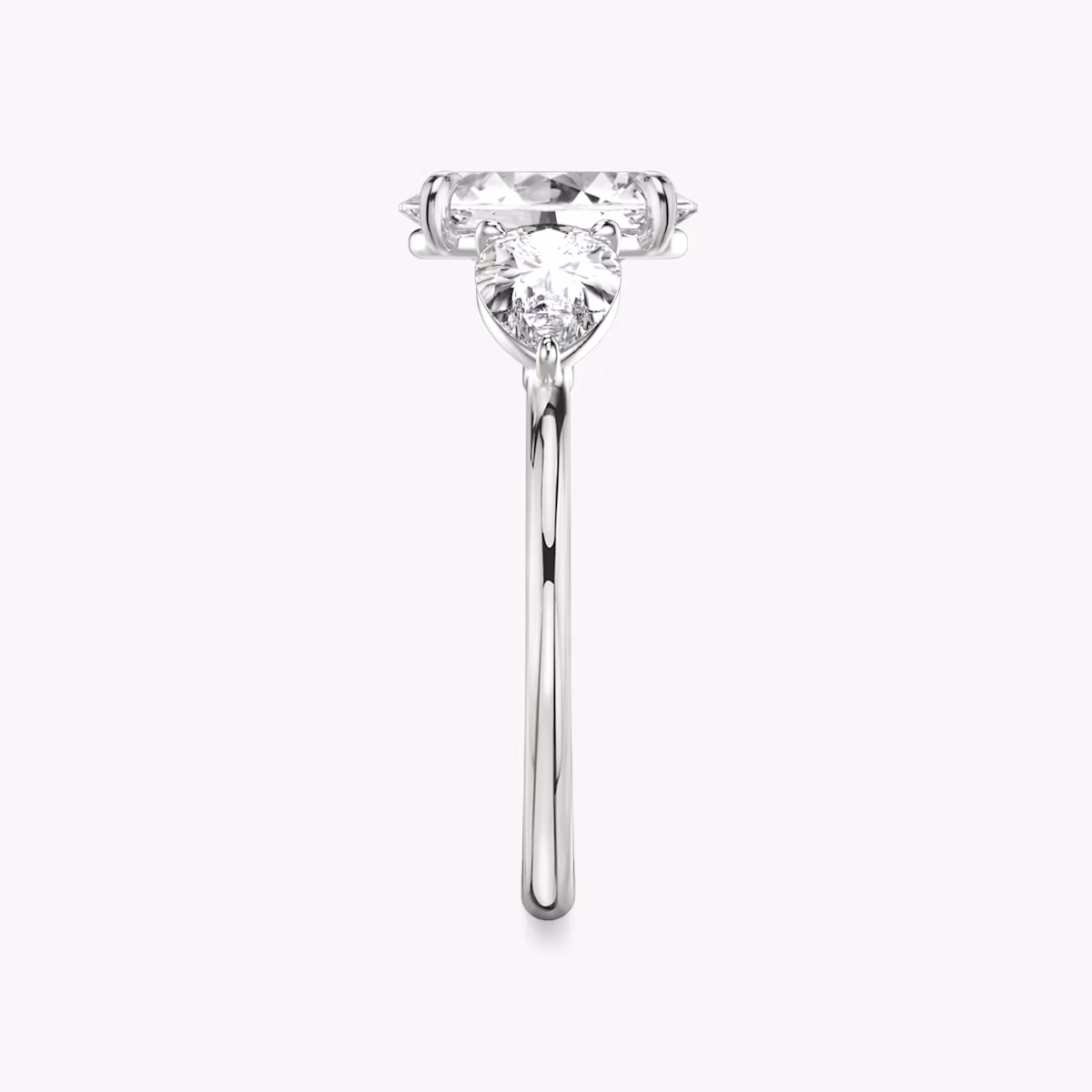 The Three Stone | Oval | Platinum | bandAccent: Plain | sideStoneCarat: 0.50ct | sideStoneShape: Pear | diamondOrientation: vertical | caratWeight: other