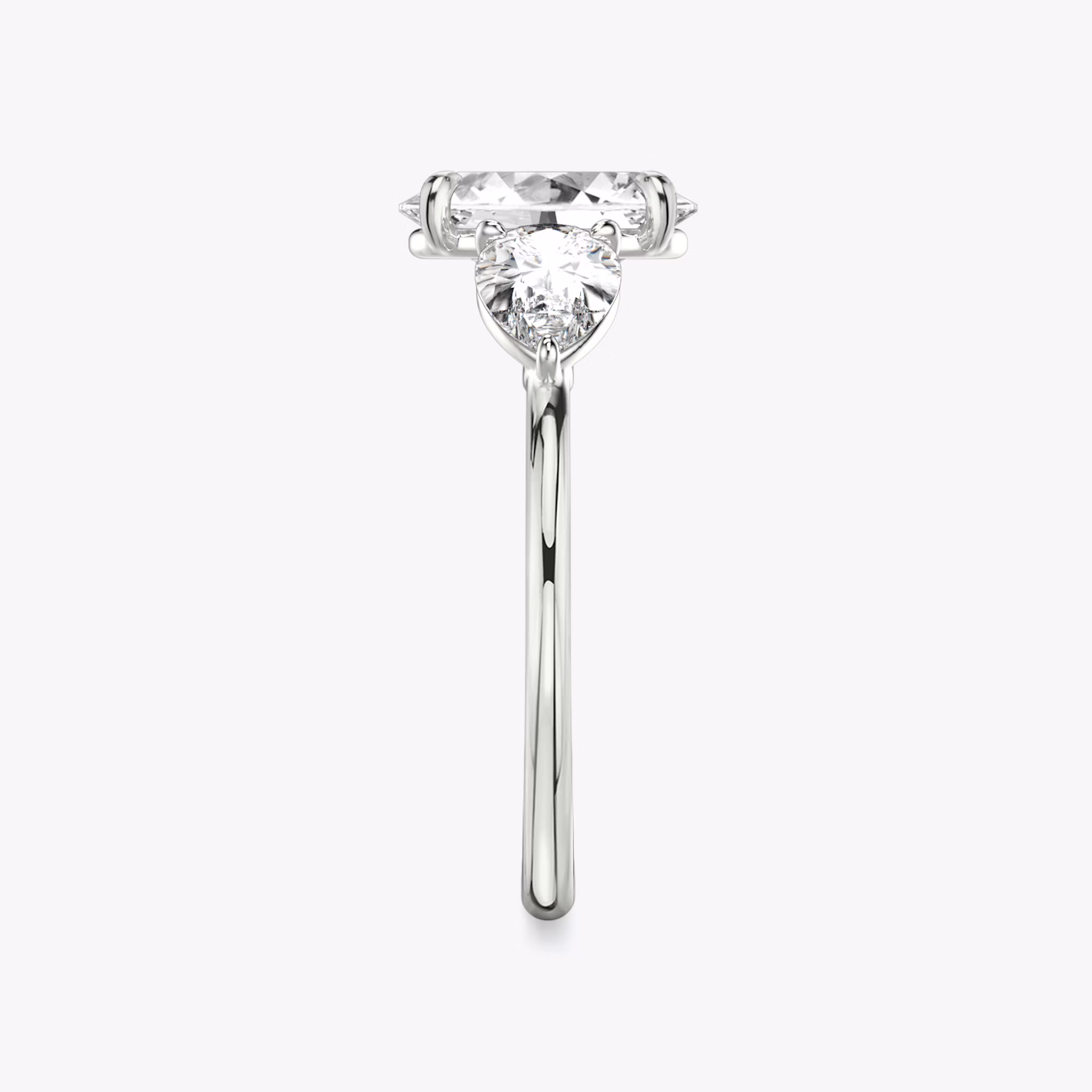 The Three Stone | Oval | 18k | White Gold | bandAccent: Plain | sideStoneCarat: 0.50ct | sideStoneShape: Pear | diamondOrientation: vertical | caratWeight: other
