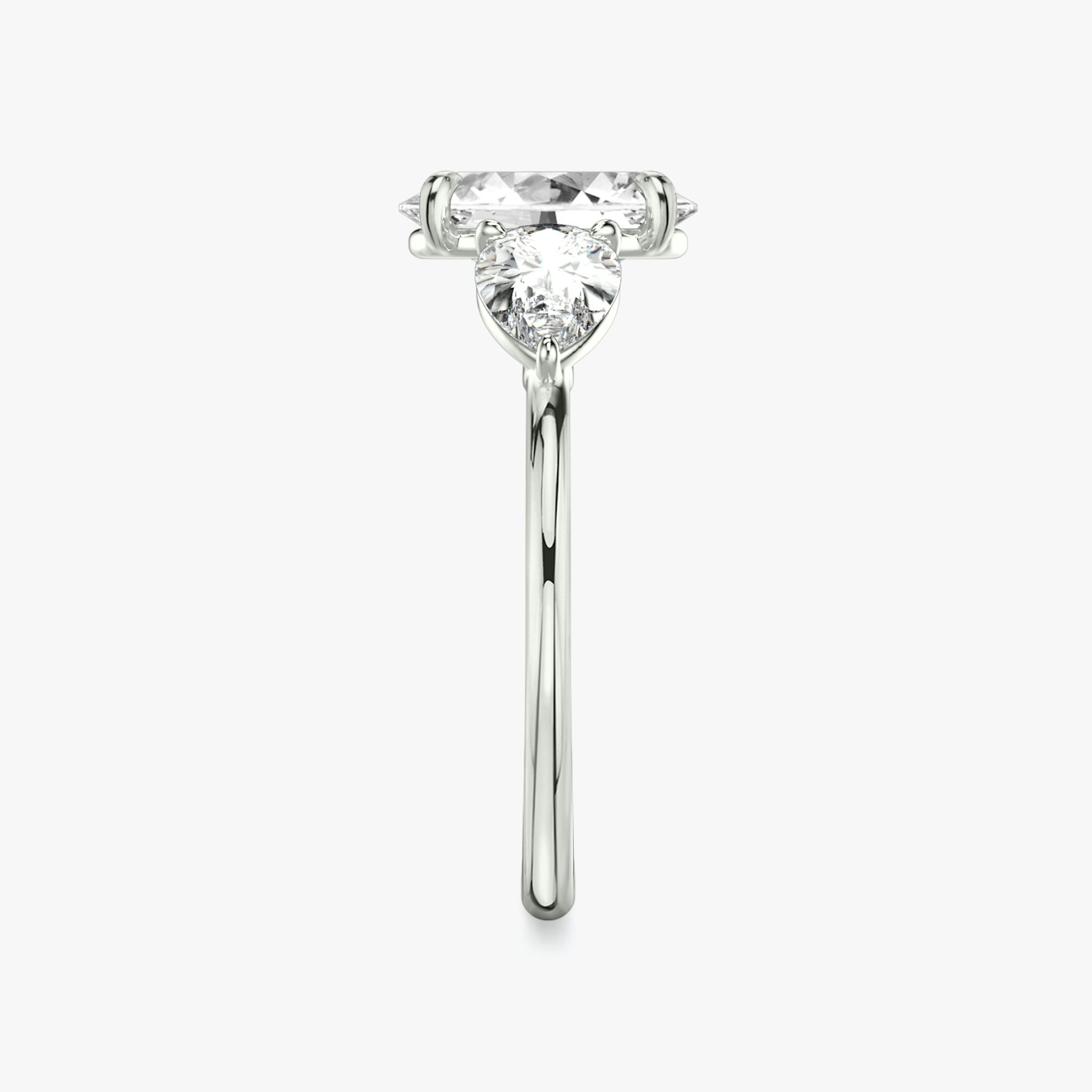 The Three Stone | Oval | 18k | White Gold | bandAccent: Plain | sideStoneCarat: 0.50ct | sideStoneShape: Pear | diamondOrientation: vertical | caratWeight: other