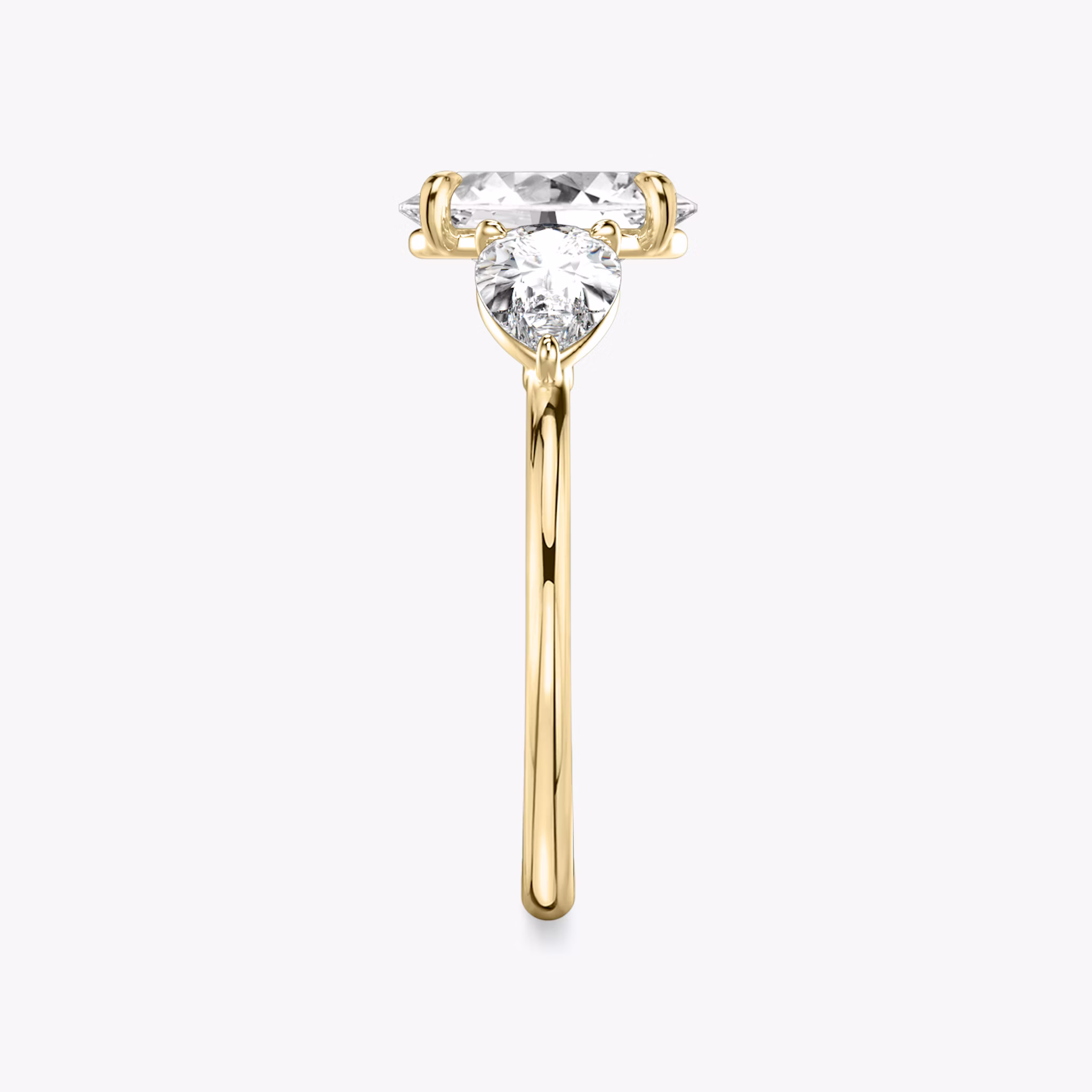The Three Stone | Oval | 18k | Yellow Gold | bandAccent: Plain | sideStoneCarat: 0.50ct | sideStoneShape: Pear | diamondOrientation: vertical | caratWeight: other