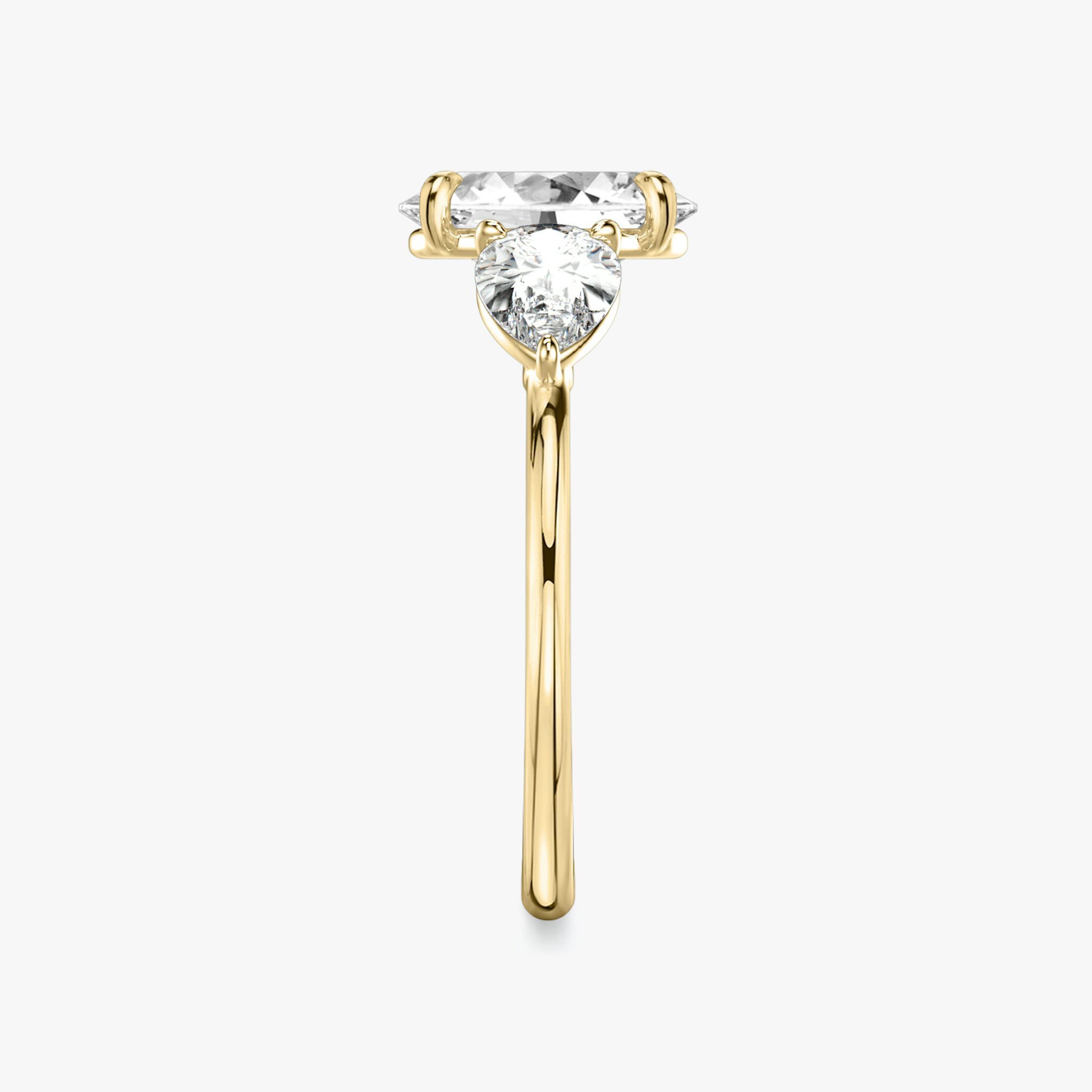 The Three Stone | Oval | 18k | Yellow Gold | bandAccent: Plain | sideStoneCarat: 0.50ct | sideStoneShape: Pear | diamondOrientation: vertical | caratWeight: other