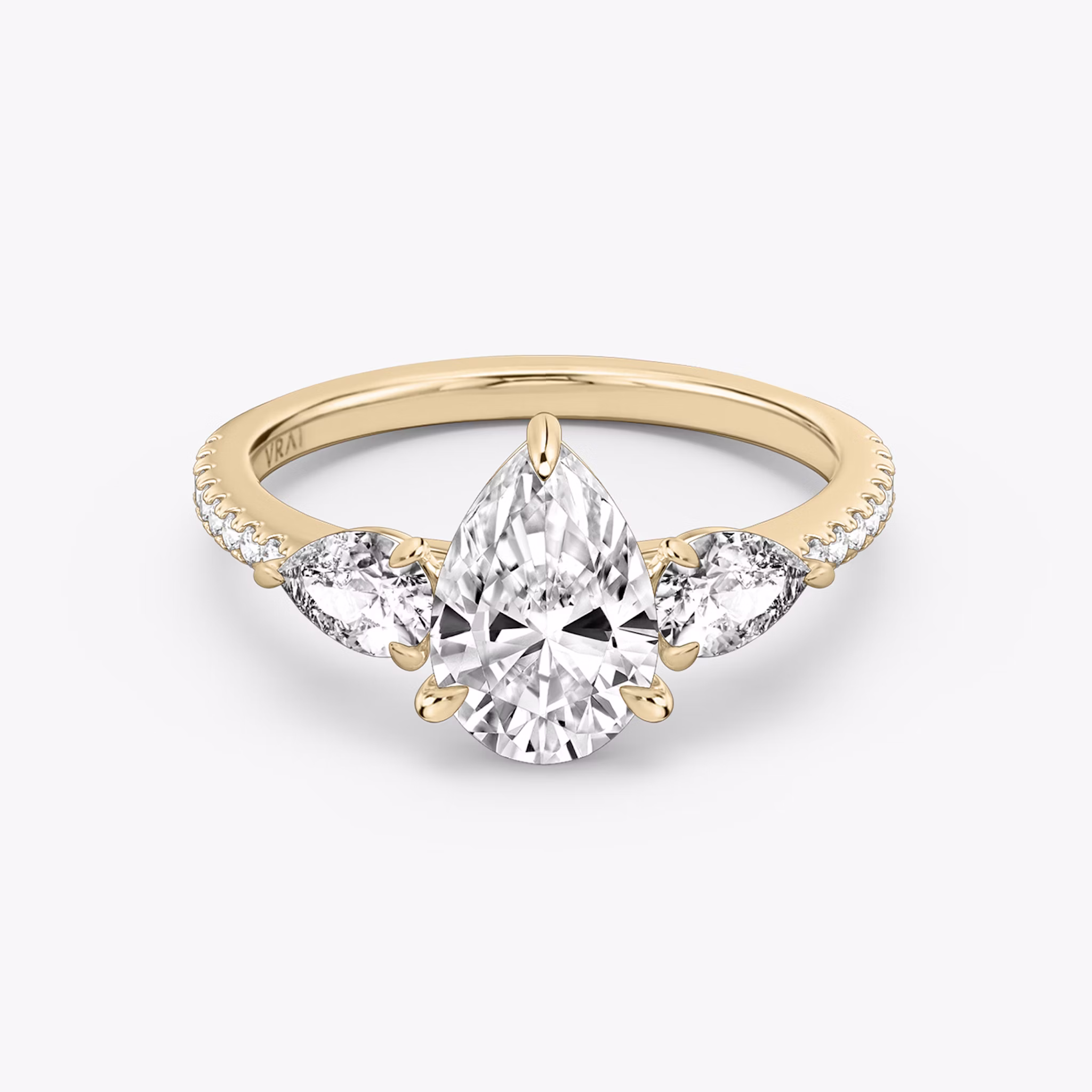 The Three Stone | Pear | 14k | Rose Gold | bandAccent: Pavé | sideStoneCarat: 0.25ct | sideStoneShape: Pear | diamondOrientation: vertical | caratWeight: other